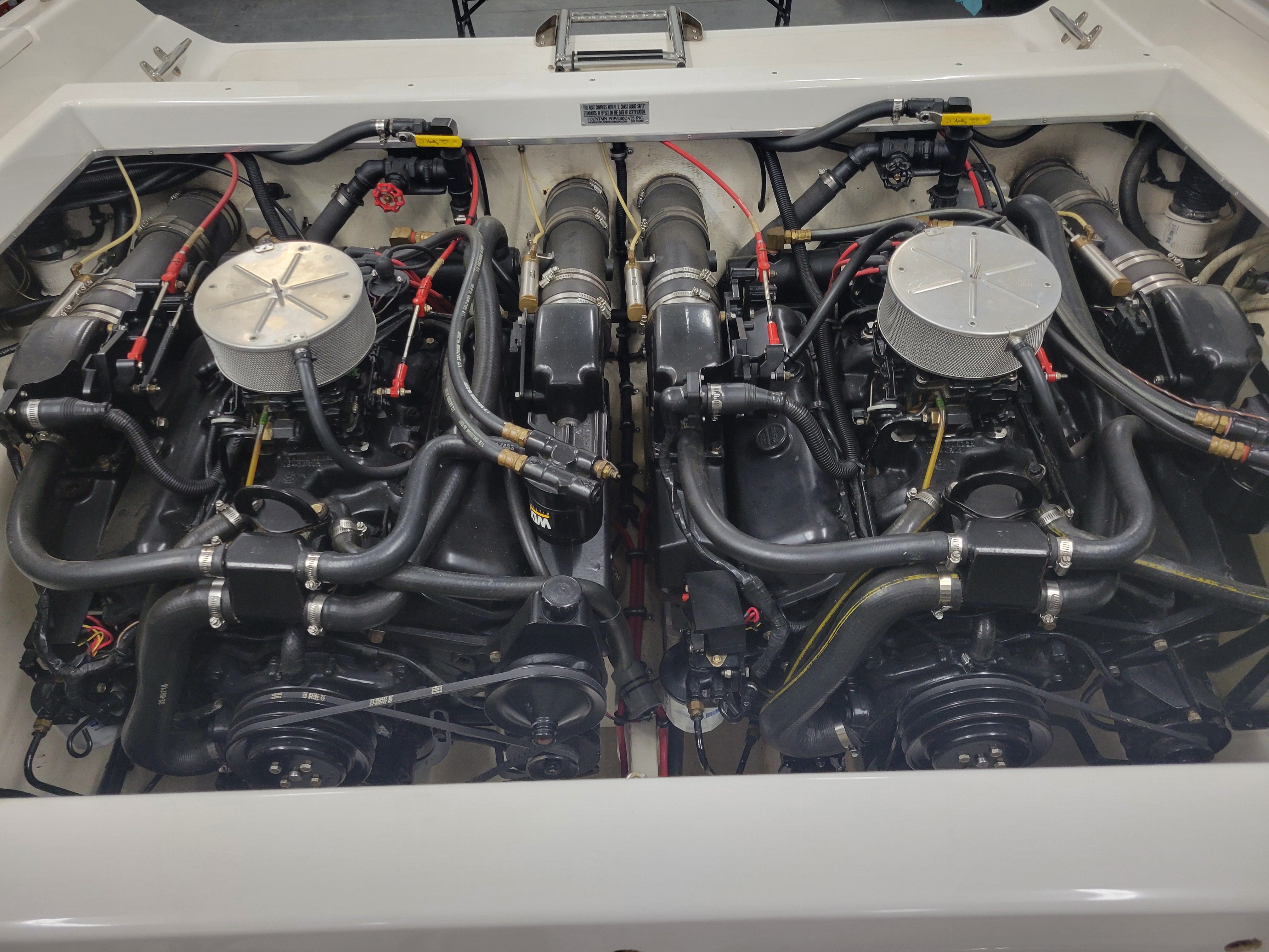 Twin engines in a 1992 Fountain Fever boat, showcasing intricate mechanical details.