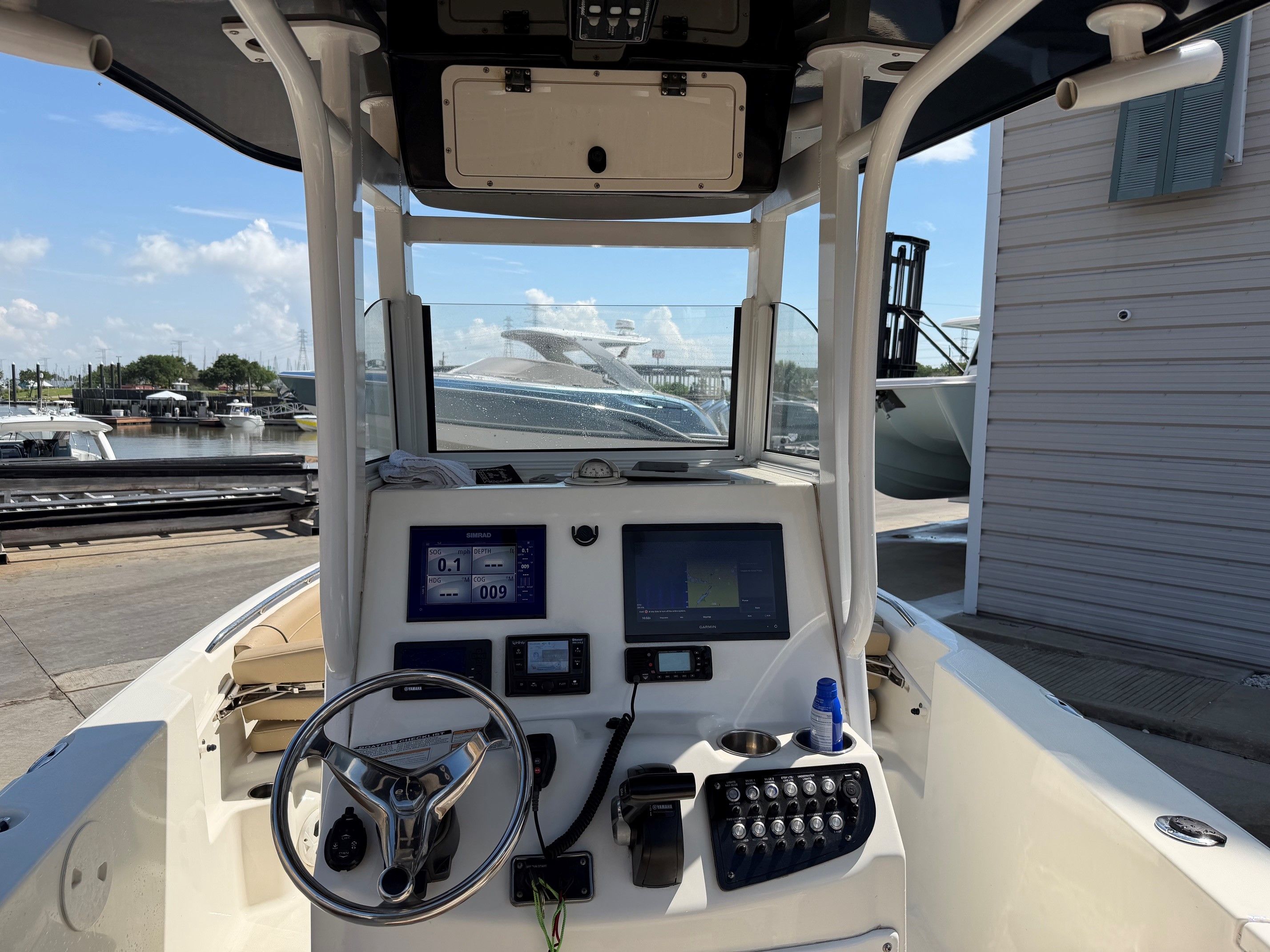 Interior view of a 2019 NauticStar 251 Hybrid boat with helm console.