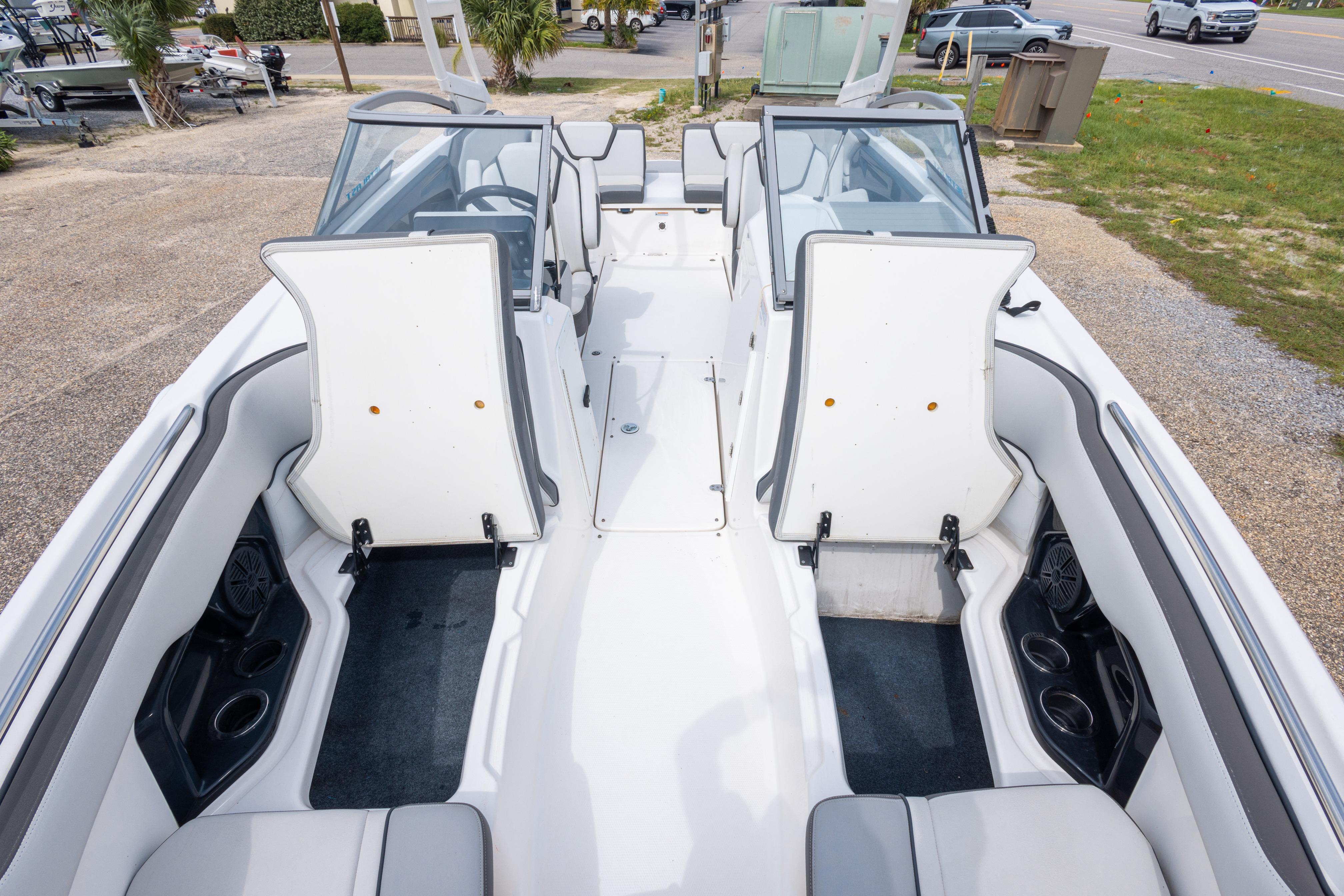 2021 Yamaha Boats AR250 interior with open storage compartments and seating.