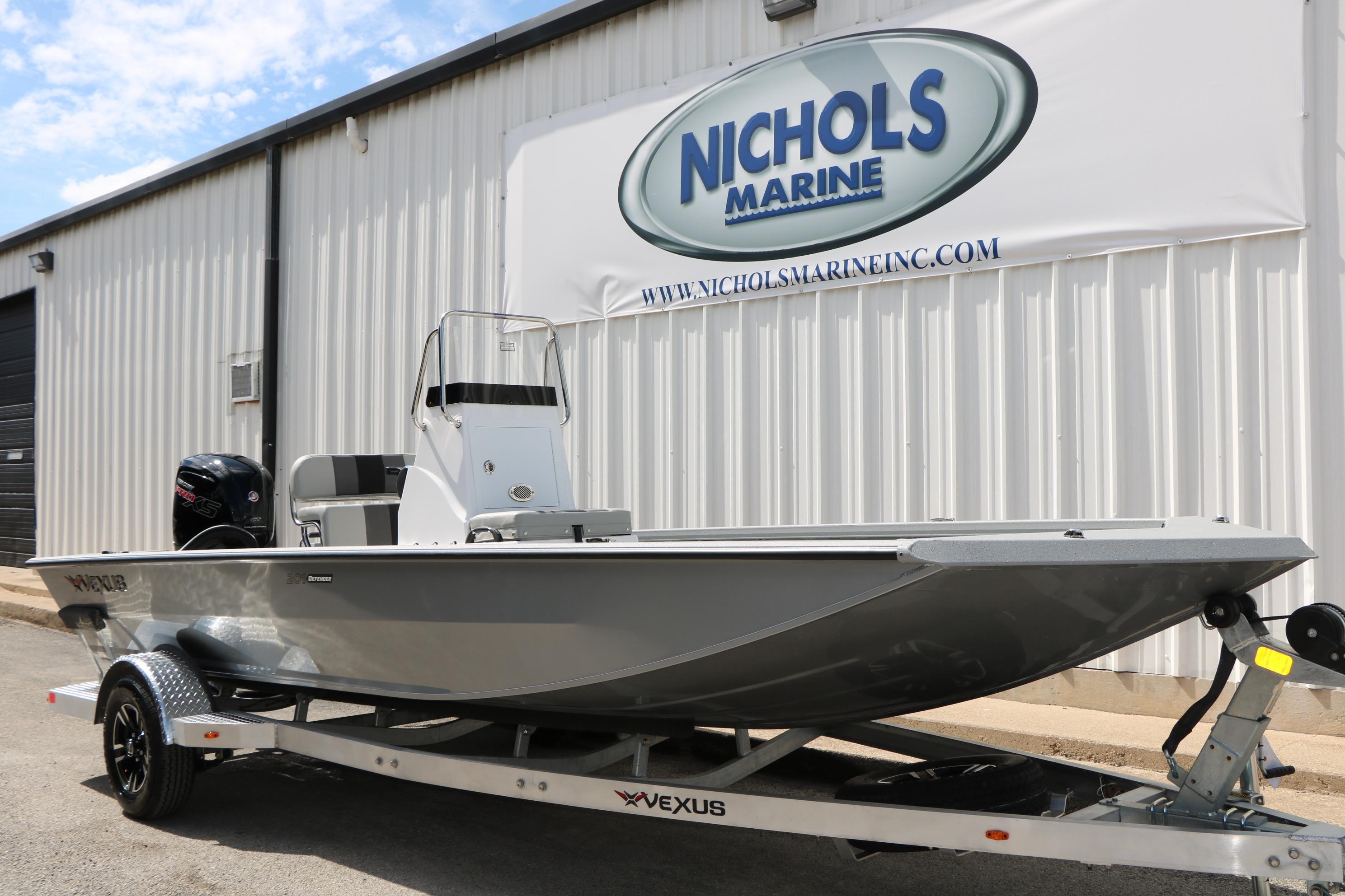 2026 Vexus Defender 201 boat on trailer at Nichols Marine dealership.