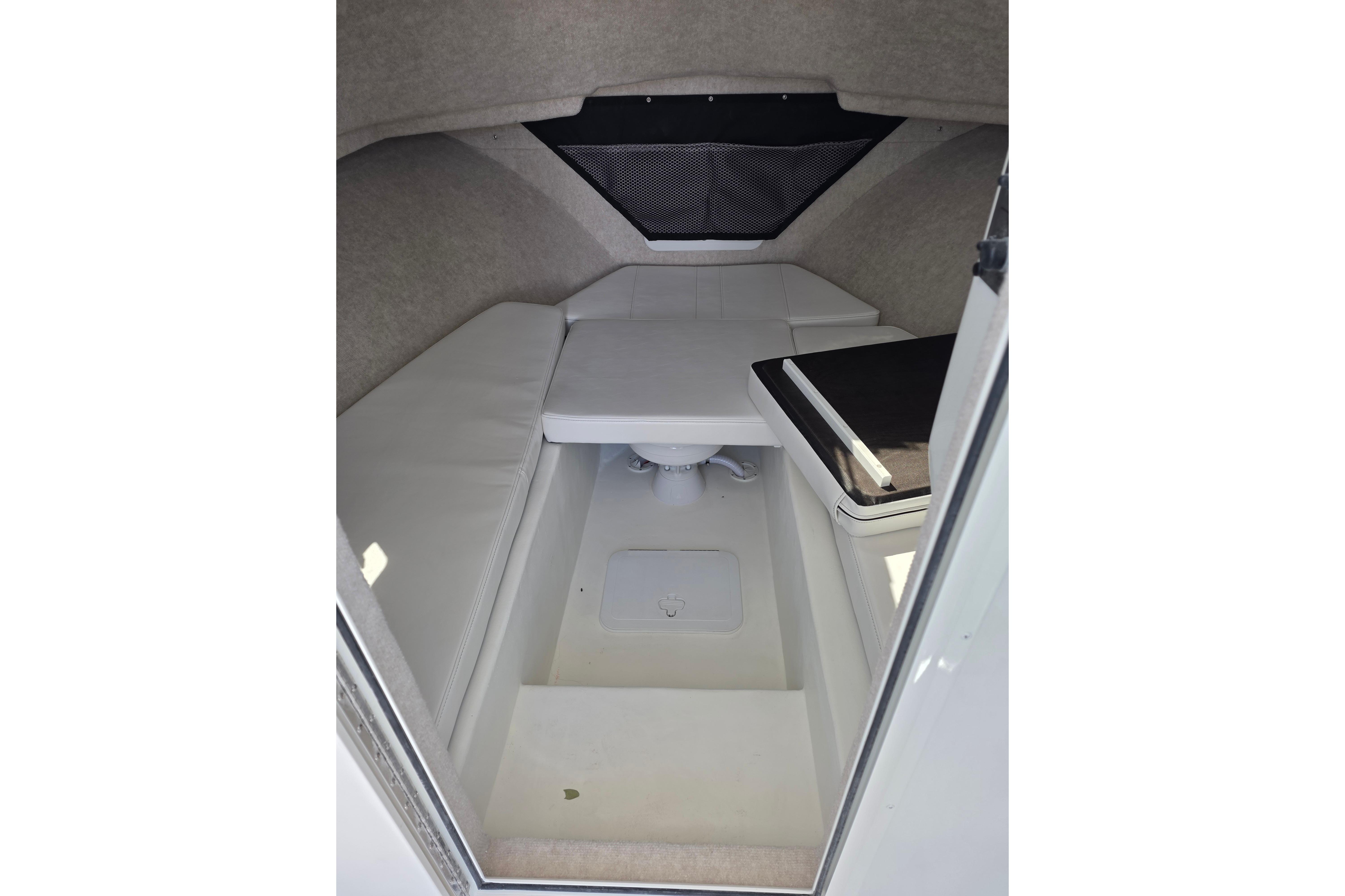 Interior cabin of 2026 Parker 287 Explorer boat, featuring seating and storage.