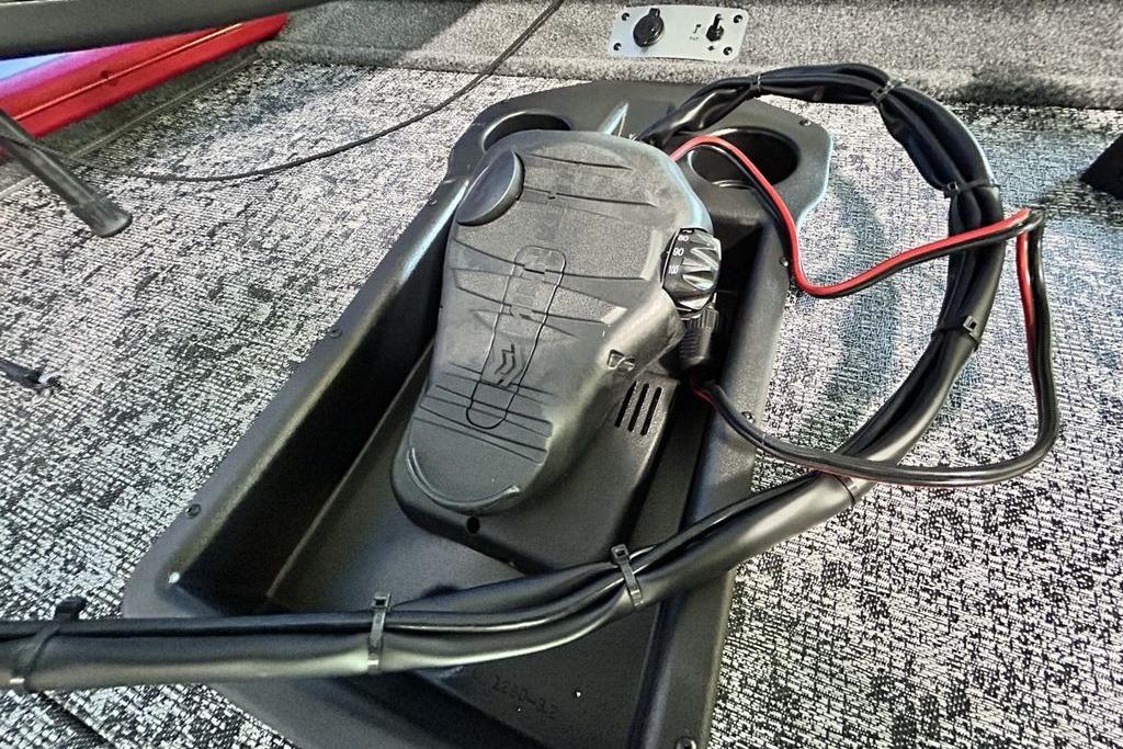 Foot pedal control on 2026 Tracker Pro Team 195 boat, with wiring and textured flooring.