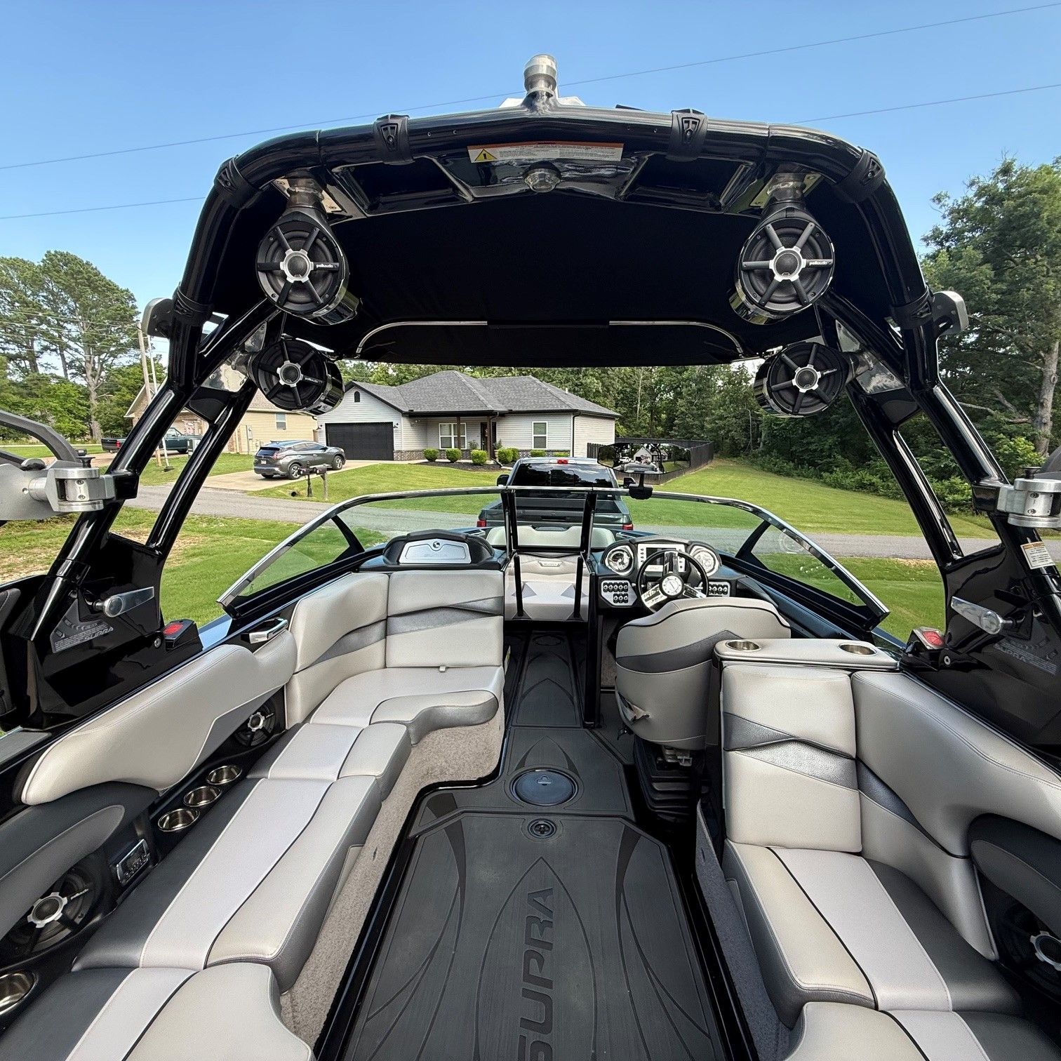 Interior view of a 2014 Supra SC350 with gray seating and a modern dashboard.