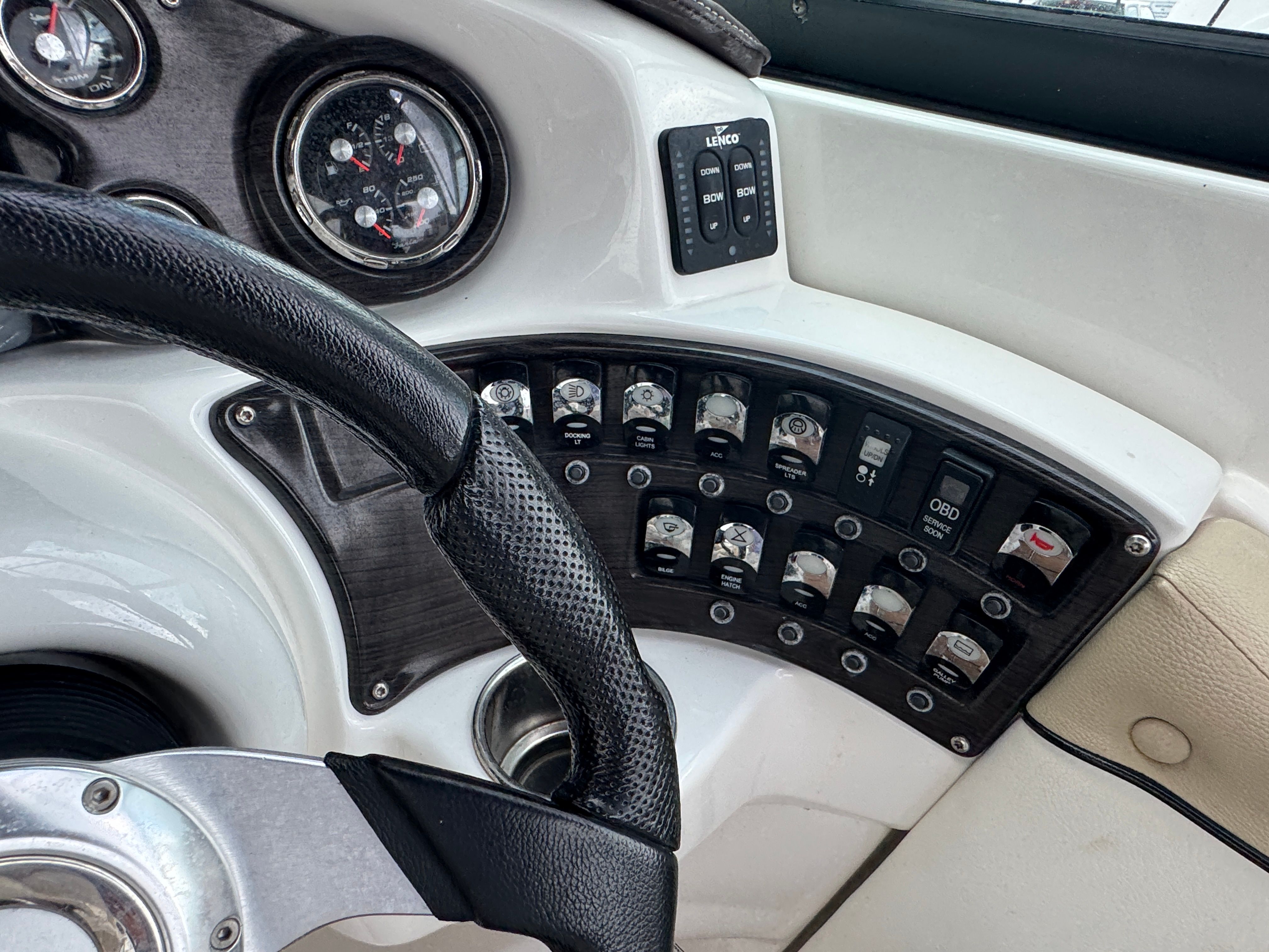 Dashboard of a 2017 Rinker QX29 BR boat with controls and switches.
