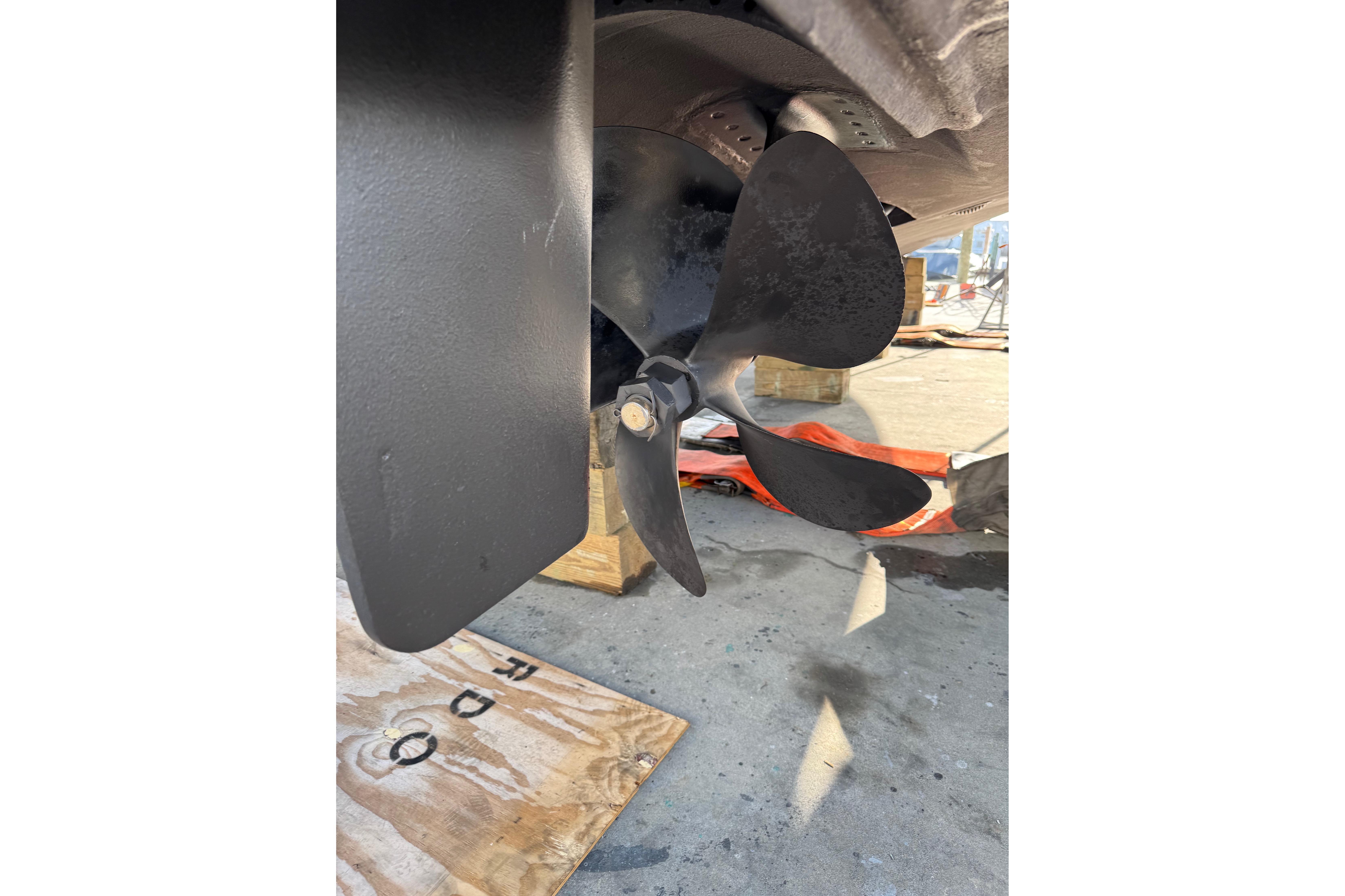 Propeller of 2013 Cabo 44 Hardtop Express boat on dry dock.
