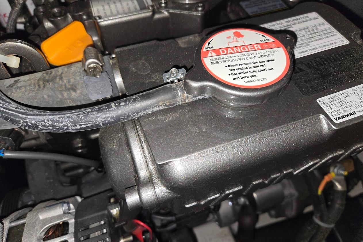 Engine compartment of a 2023 Beneteau Oceanis 38.1 sailboat, featuring a Yanmar engine.