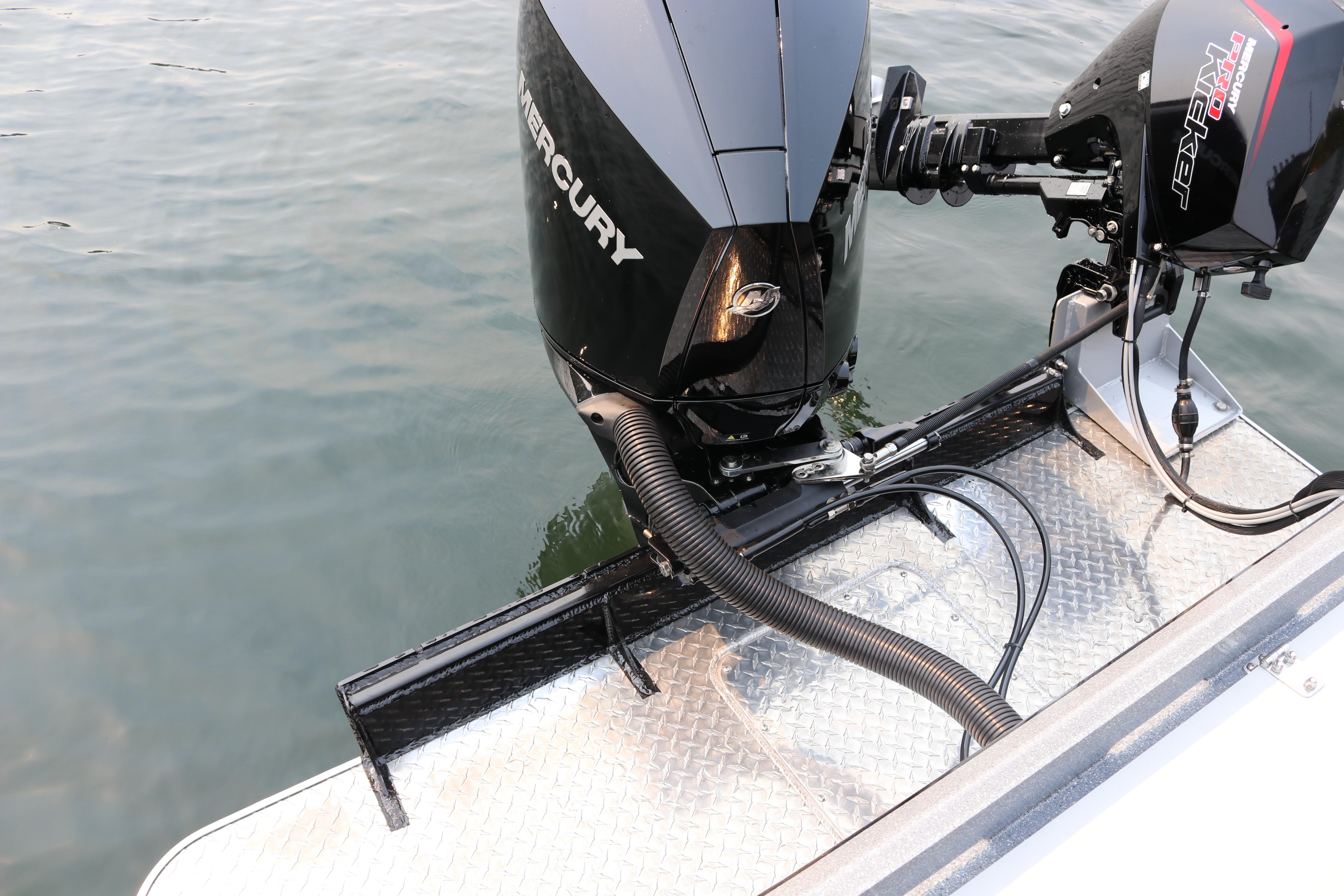 Outboard motors on 2026 KingFisher 2425 Escape HT boat, docked on water.