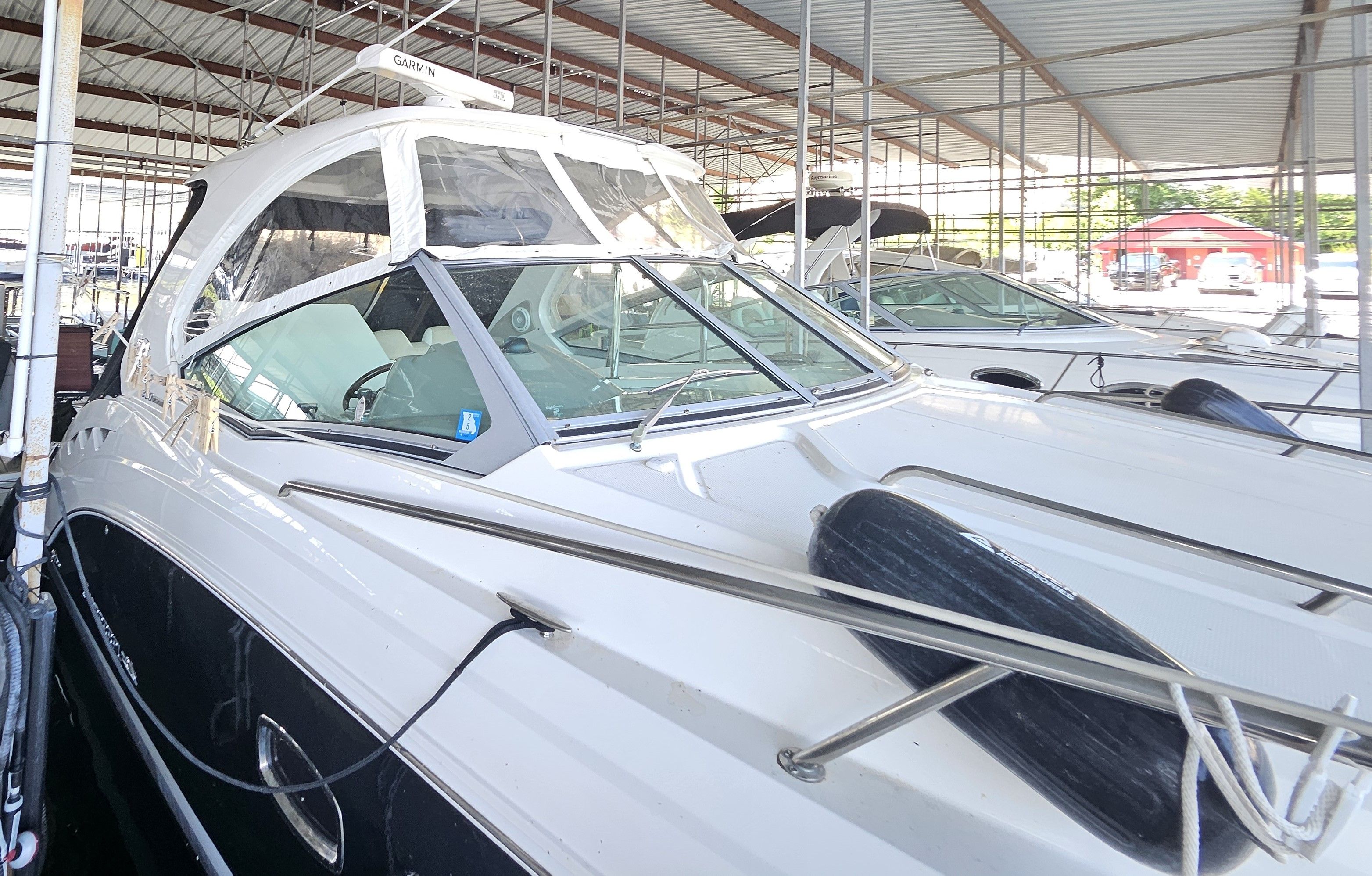 2014 Chaparral 330 Signature yacht docked, side view.