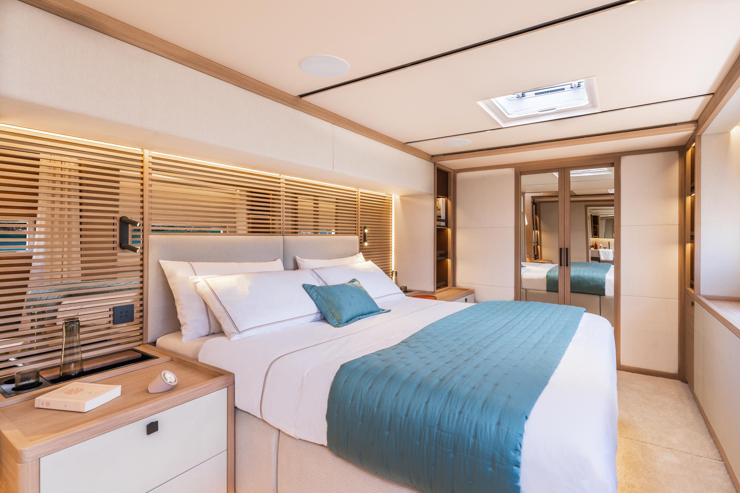 Luxurious bedroom interior of 2025 Lagoon Eighty 2 yacht with modern design and elegant decor.