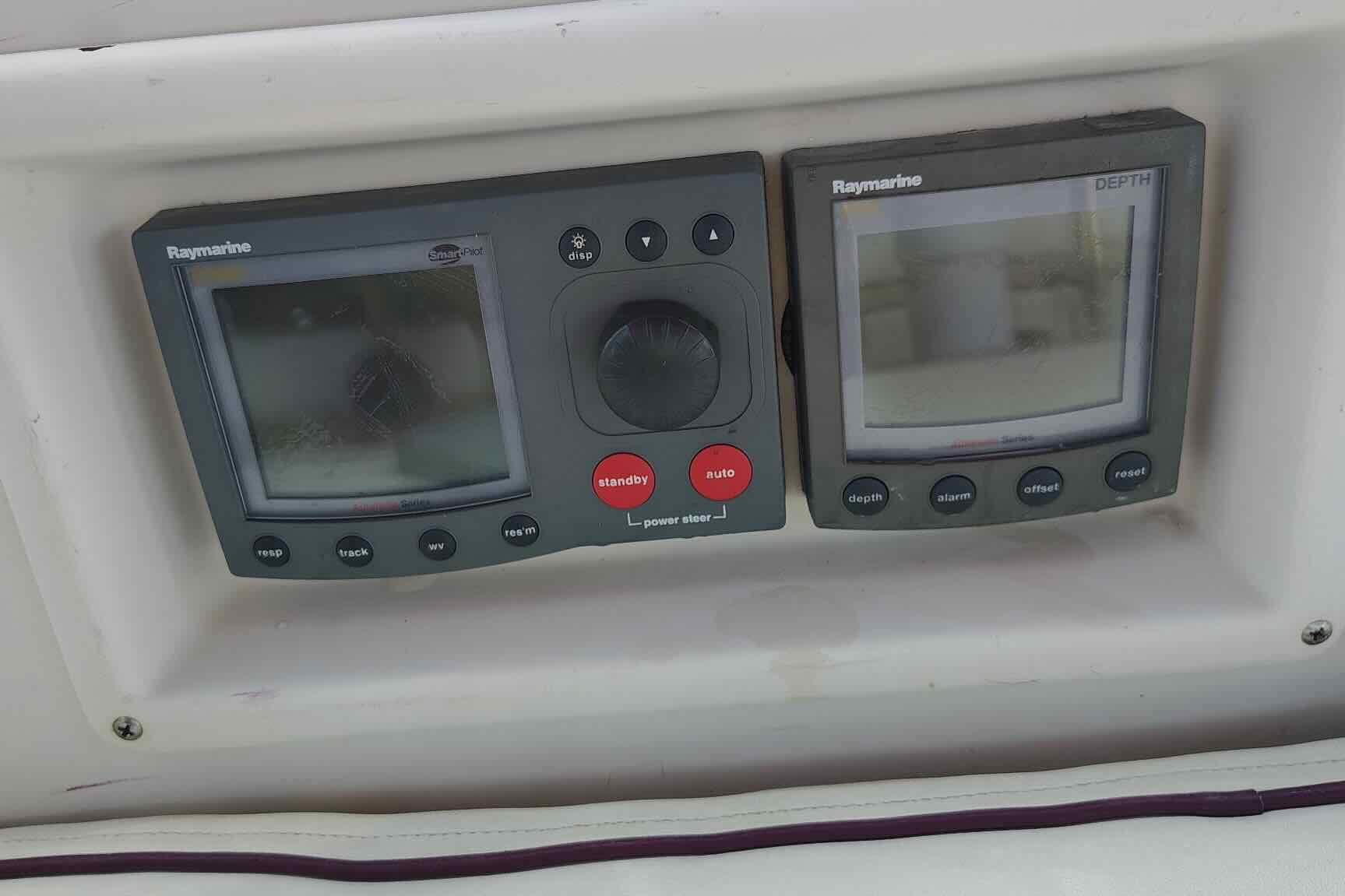 Raymarine navigation instruments on 1989 Island Packet 35 sailboat dashboard.