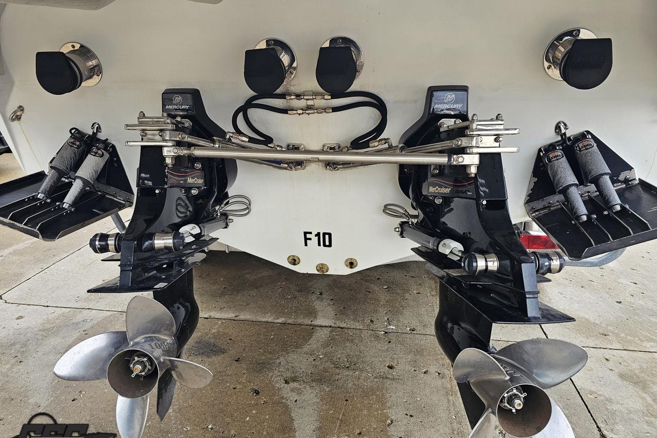 Rear view of a 2008 Baja 335 Performance boat with dual Mercury outdrives.