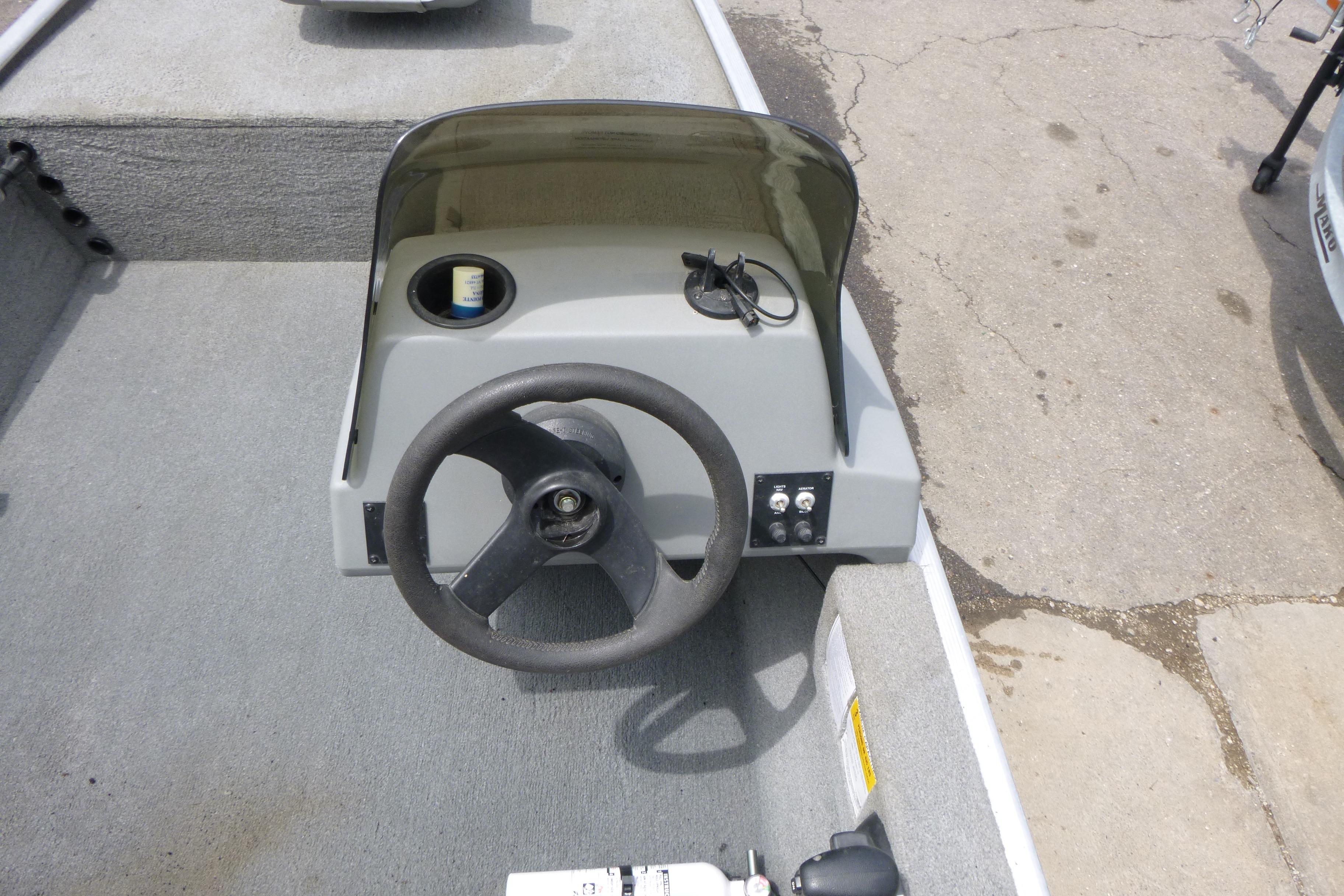 2011 Tracker Pro Angler 16 boat console with steering wheel and controls.