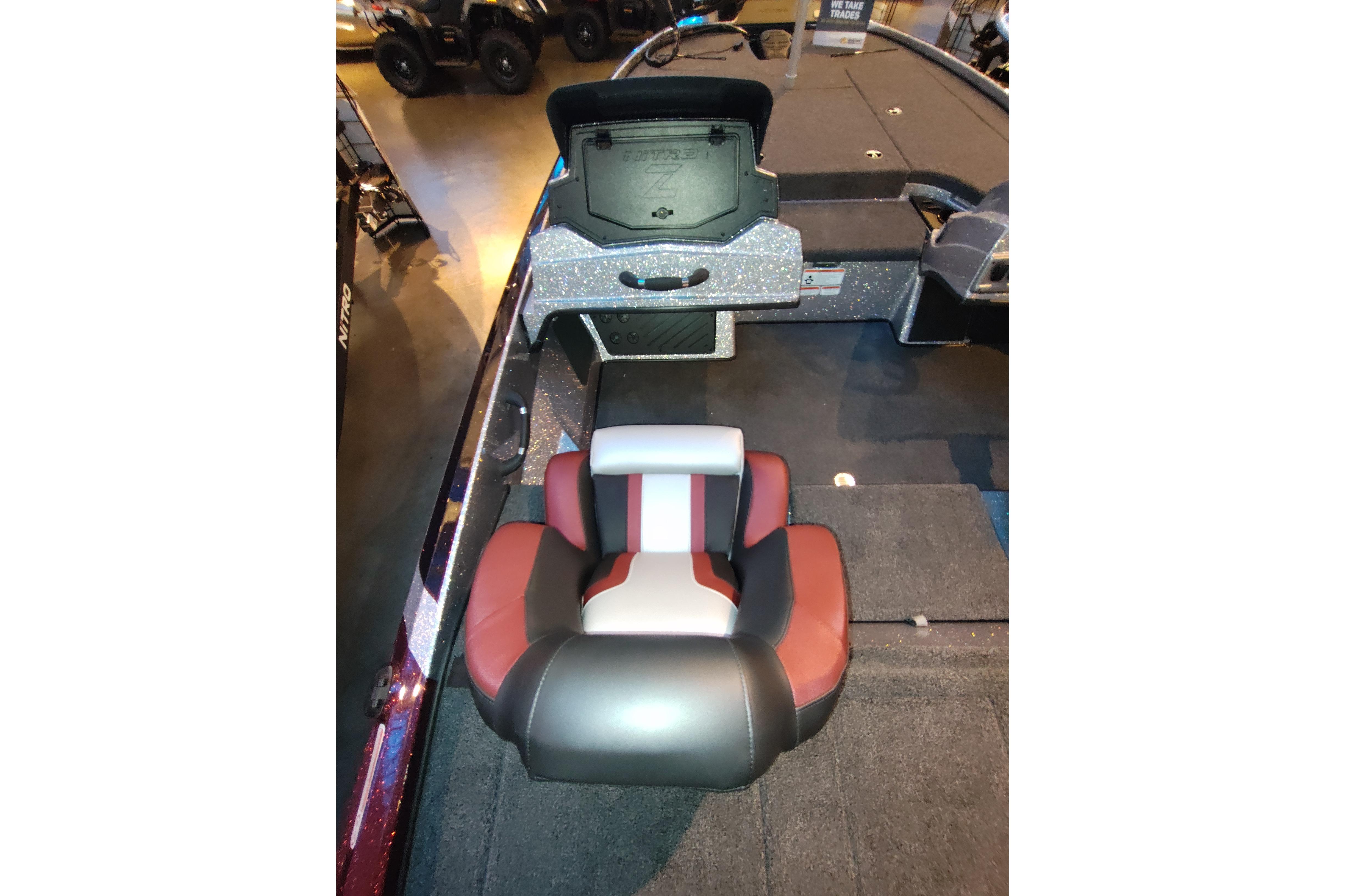 2026 Nitro Z18 boat interior with cushioned seat and storage compartment.