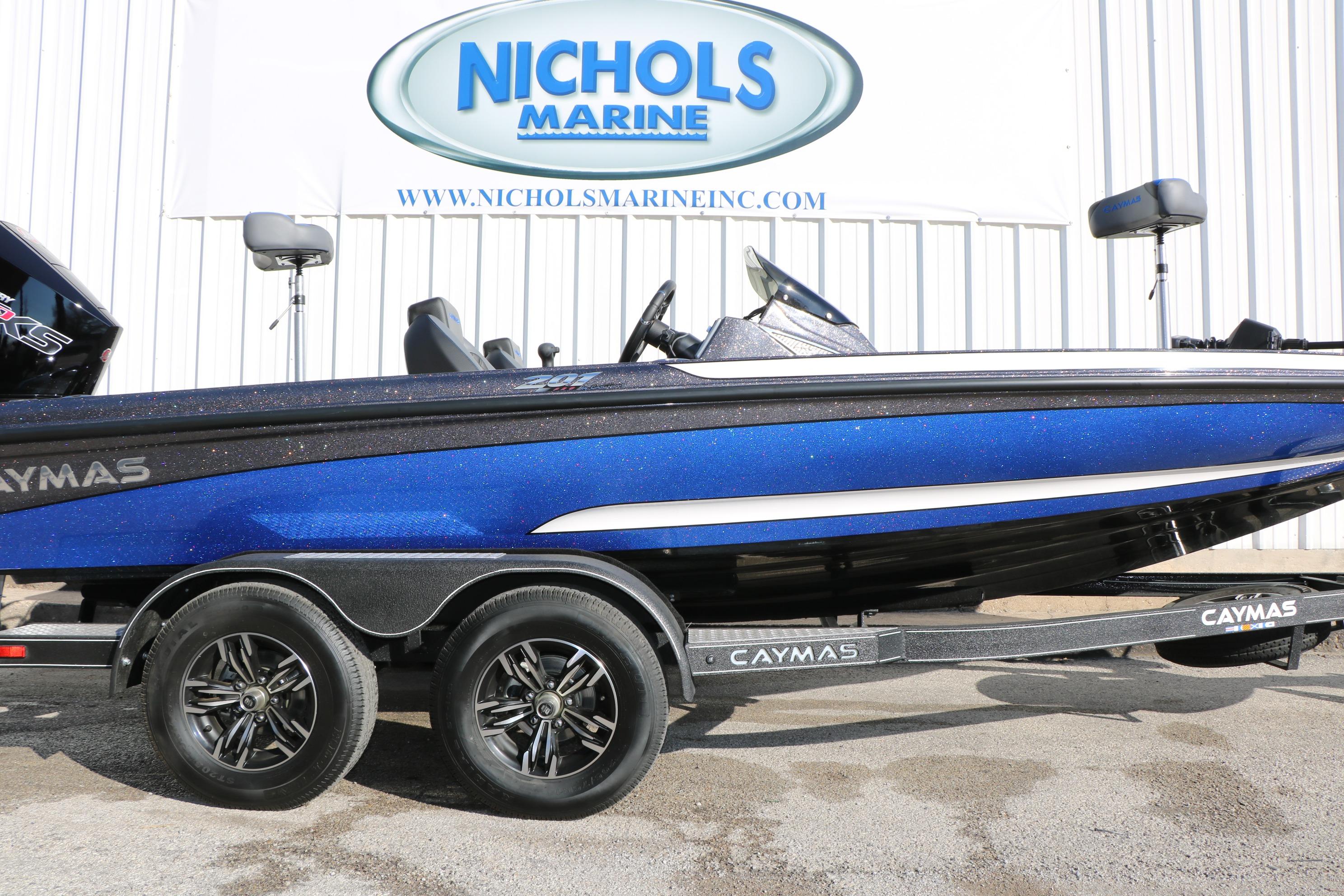 2027 Caymas 201 Pro boat in blue on trailer at Nichols Marine dealership.