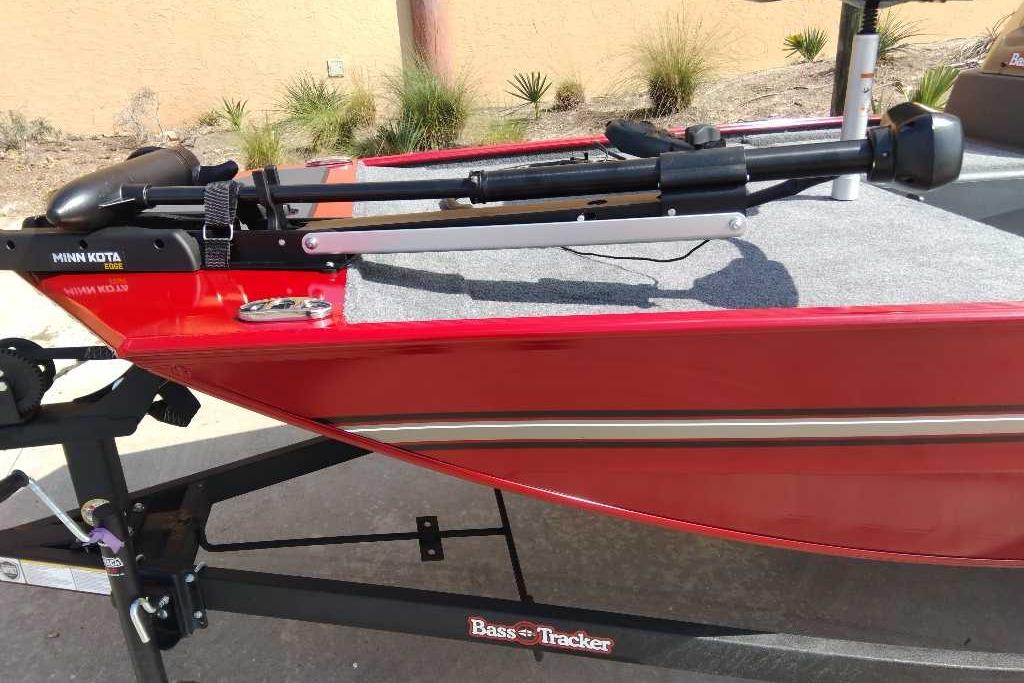2026 Tracker Bass Tracker Classic XL boat with Minn Kota trolling motor, red exterior.