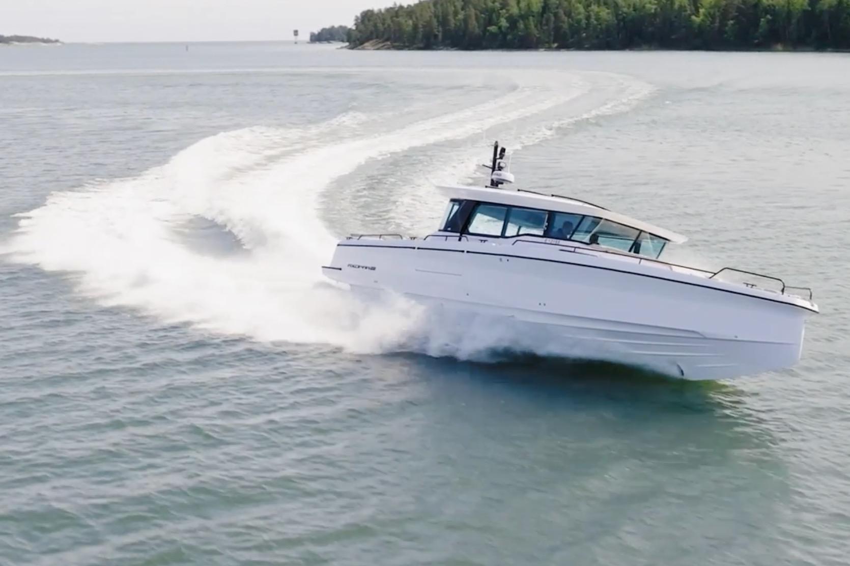 2027 Axopar 45 XC Cross Cabin cruising swiftly on open water.