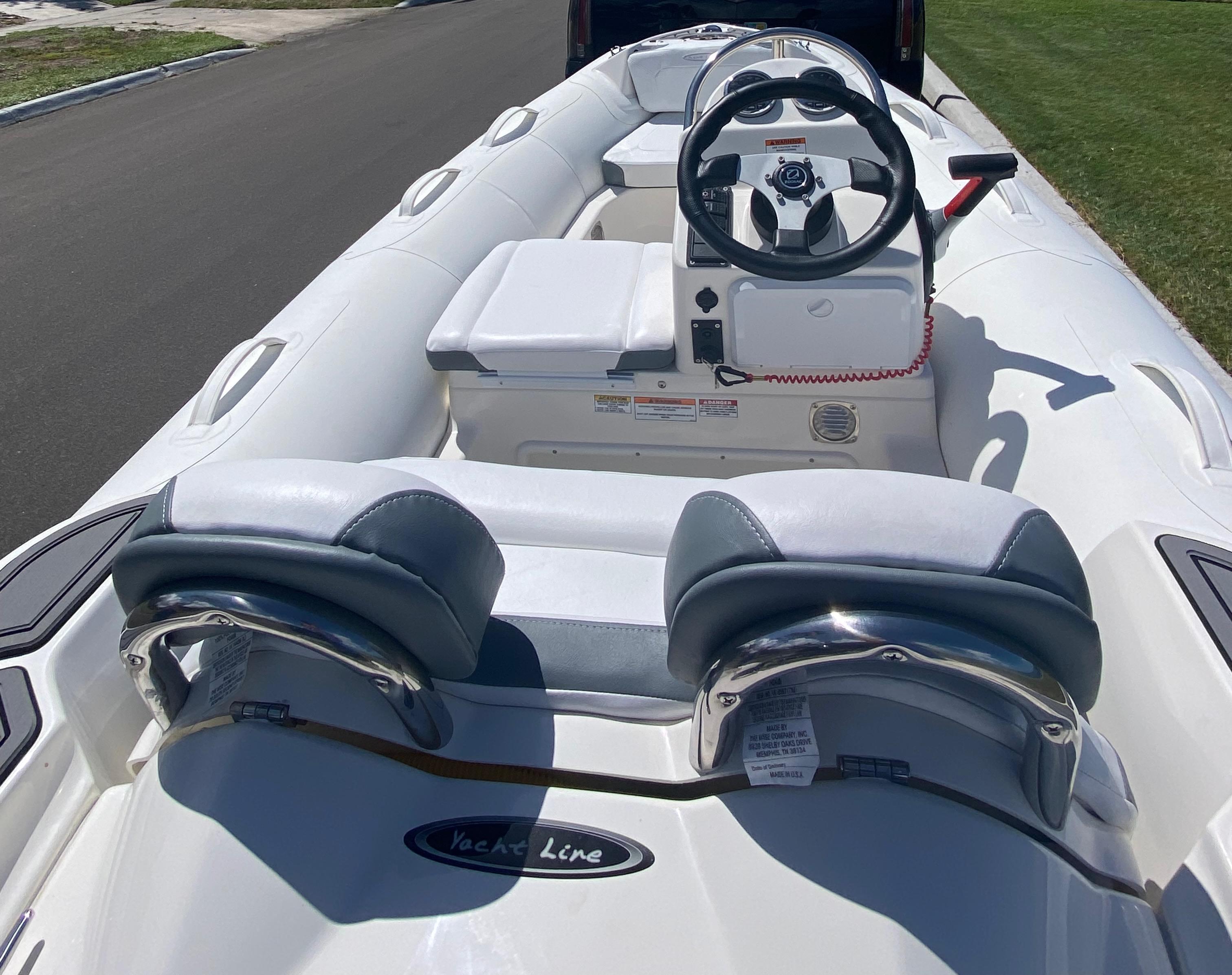 2024 Zodiac Yachtline 360 inflatable boat interior with steering console and seating.