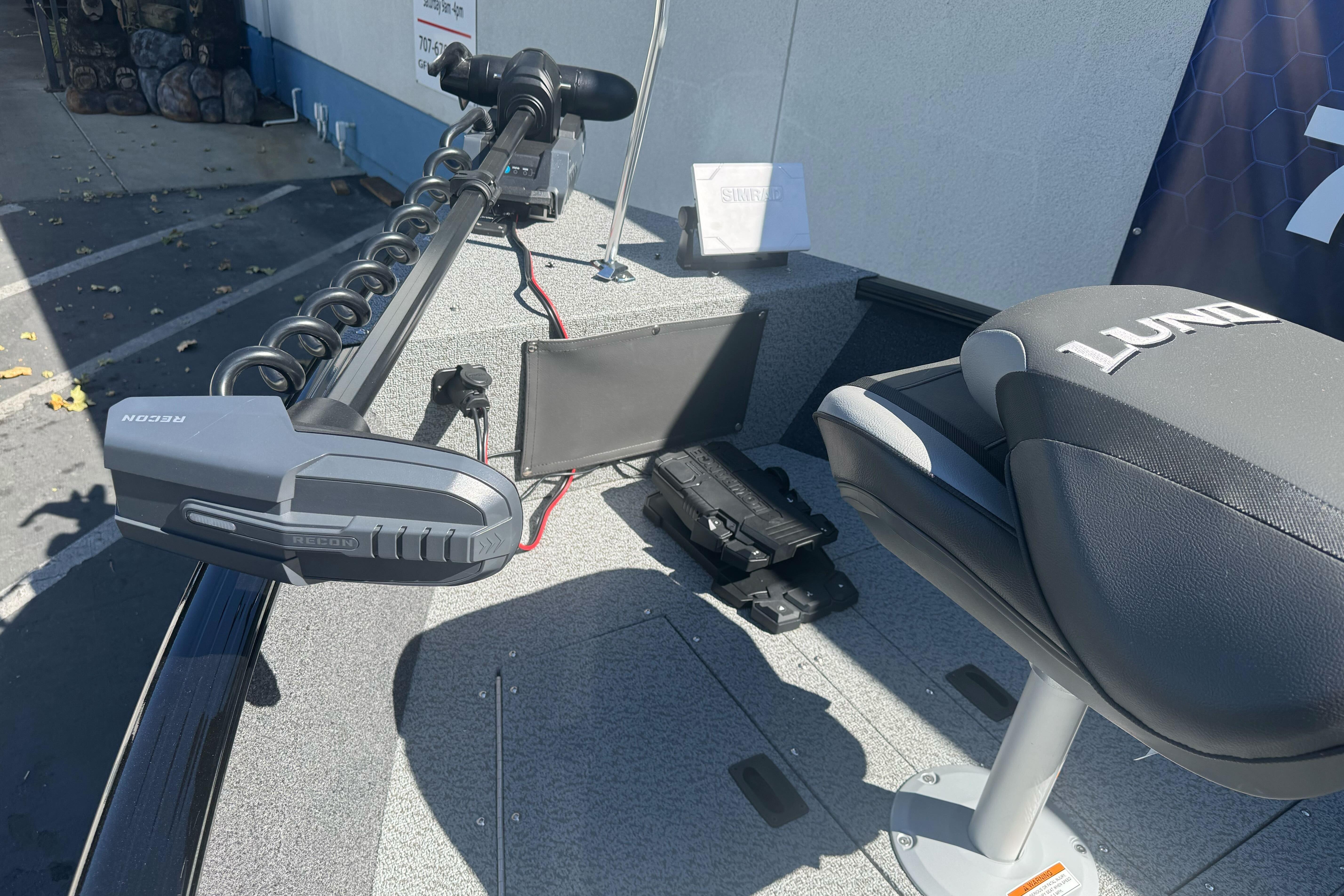 2026 Lund 1650 Rebel XL SS boat interior with seating and trolling motor.