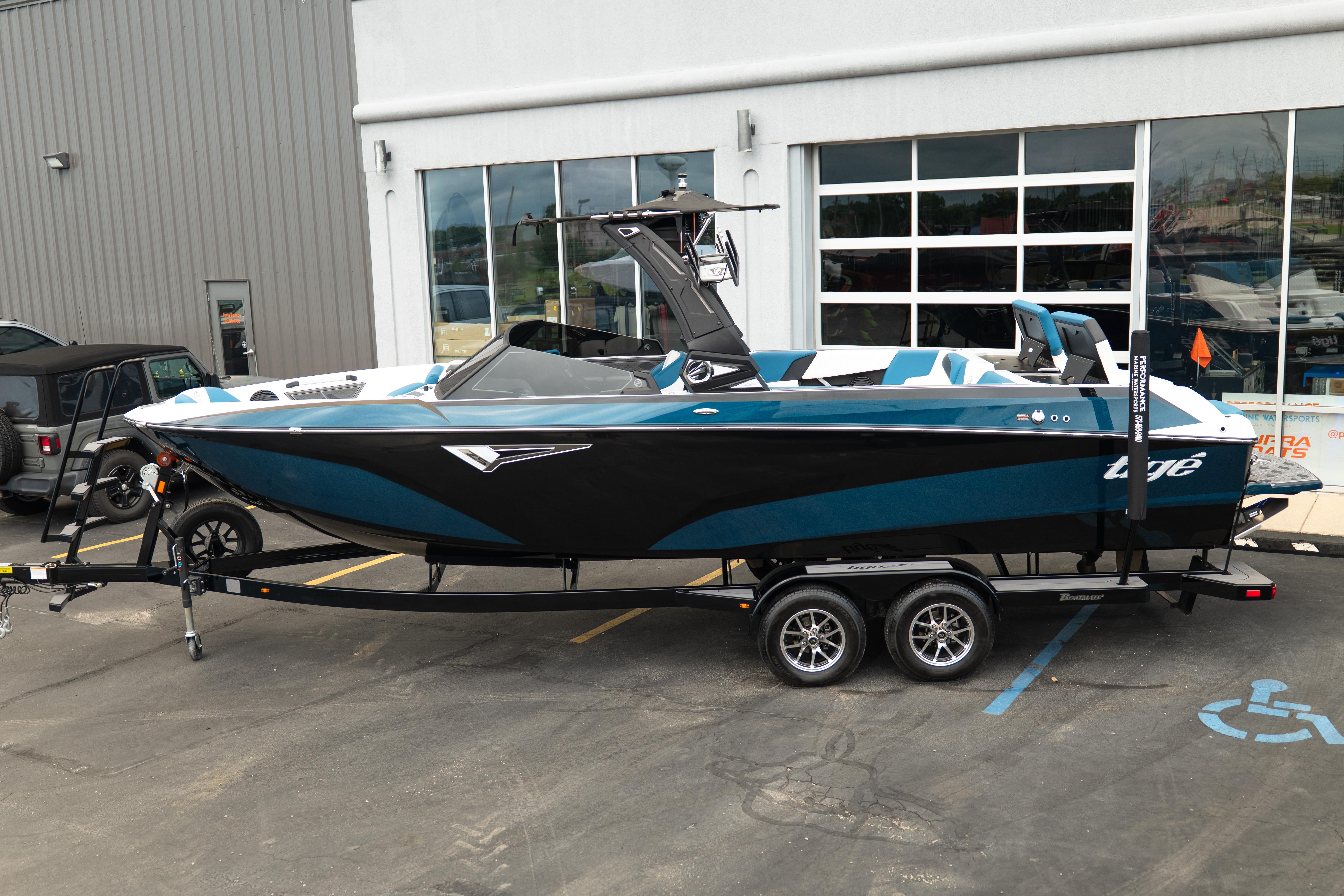2024 Tigé Z5 boat on trailer, parked outside dealership, showcasing sleek design and modern features.