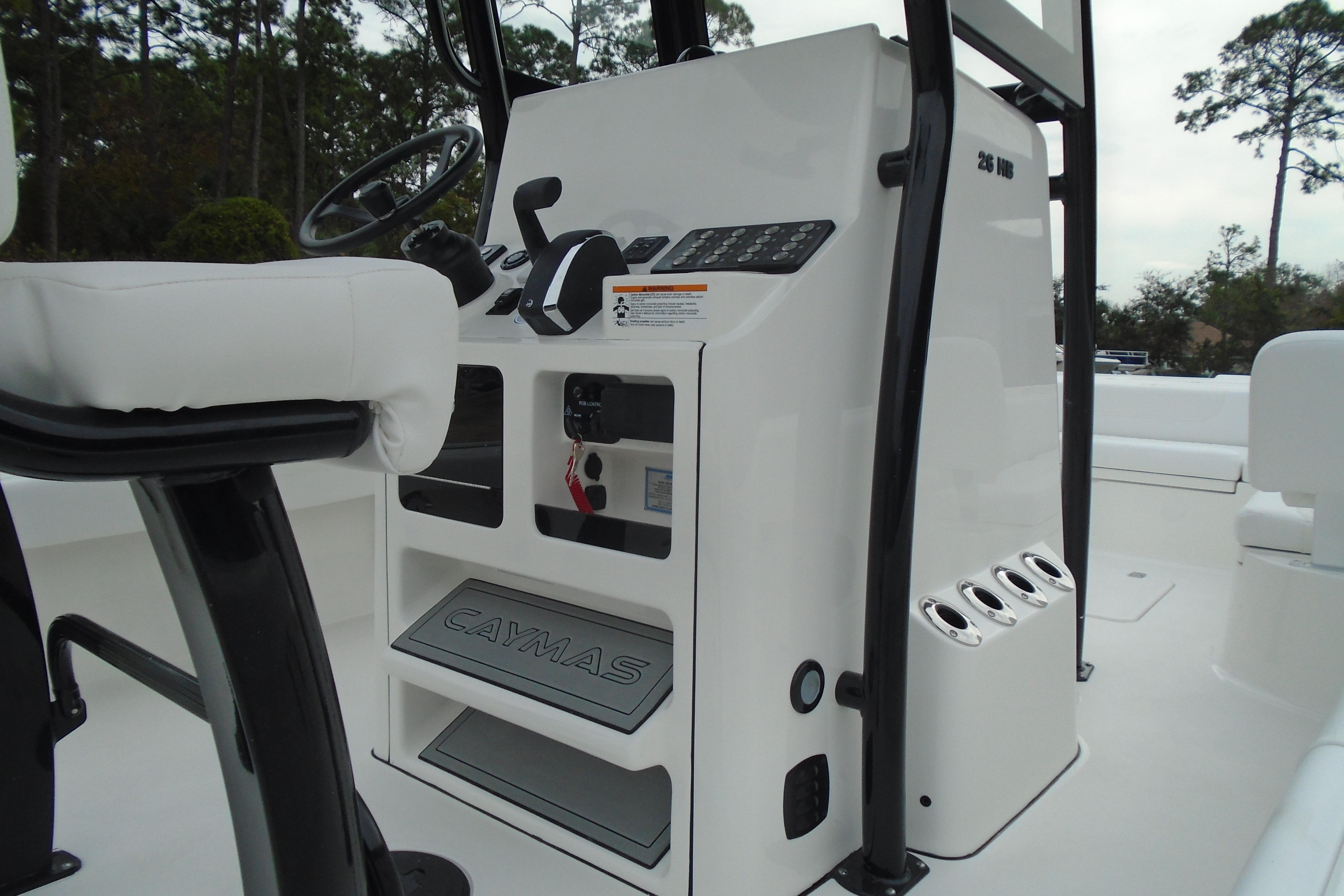 2026 Caymas 26 HB boat console with steering wheel and controls.
