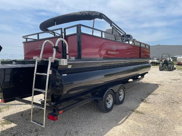 2023 Regency 250 DL3 pontoon boat on trailer, featuring a sleek red and black design.
