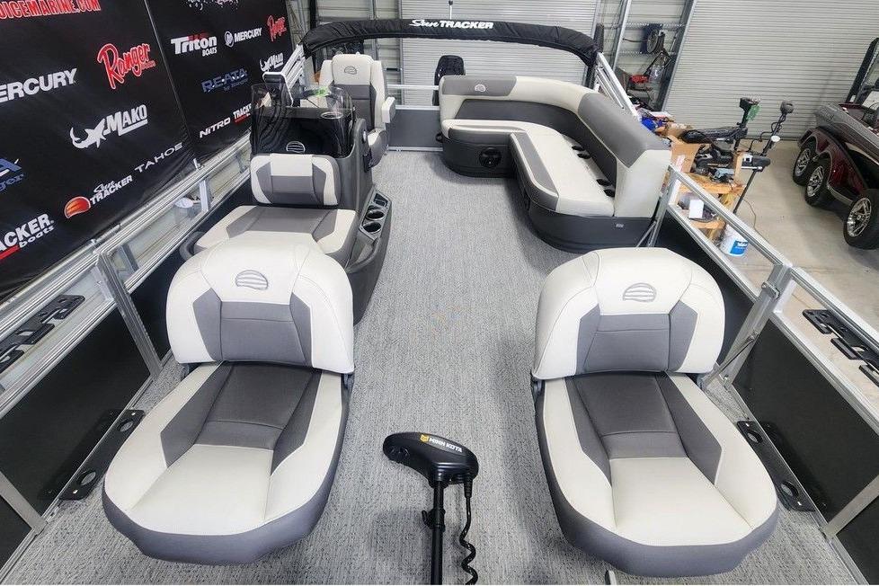2026 Sun Tracker Bass Buggy 16 DLX pontoon boat interior with gray seating and modern design.