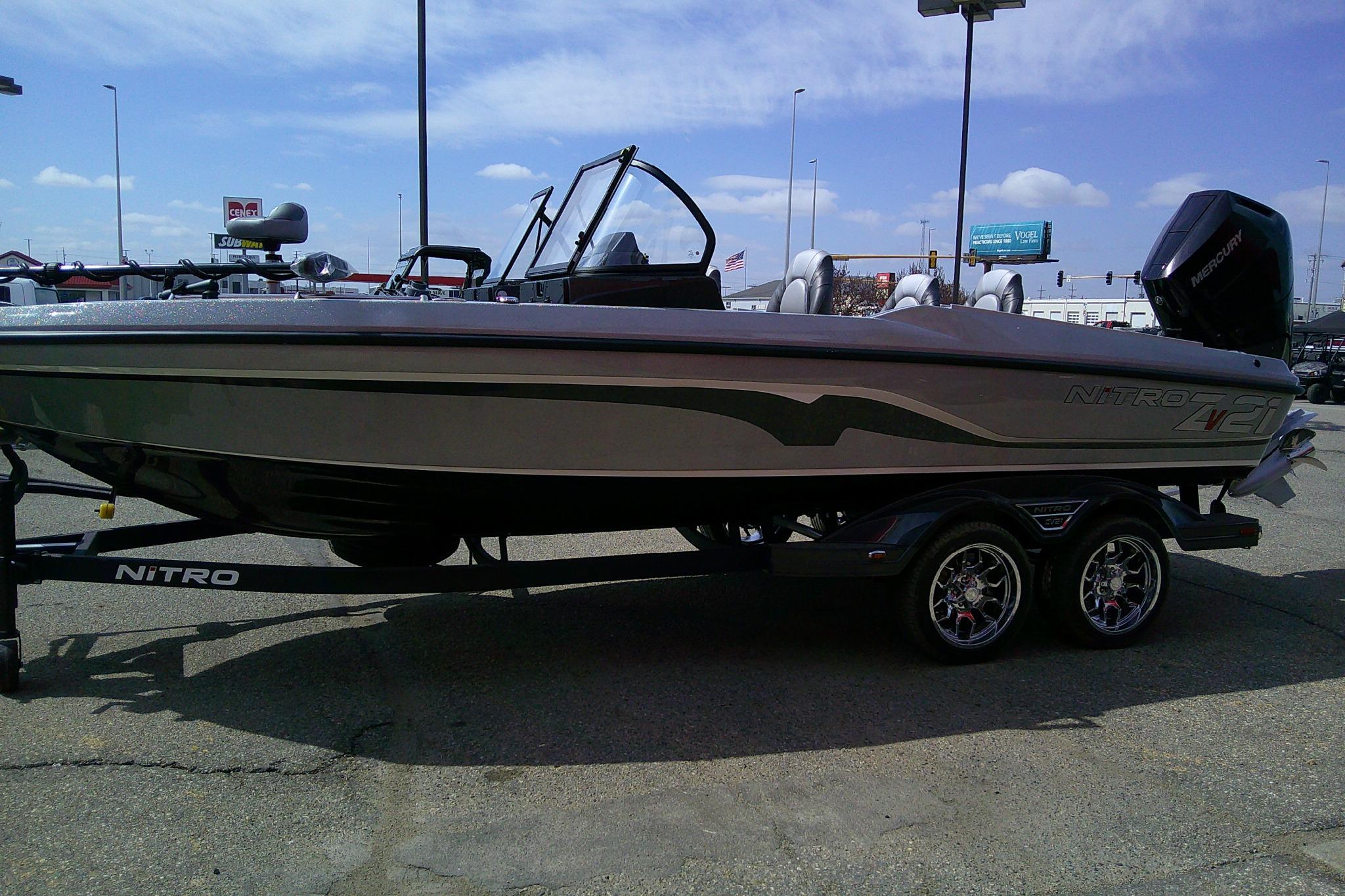 2026 Nitro ZV21 Pro fishing boat on trailer, parked outdoors under clear sky.