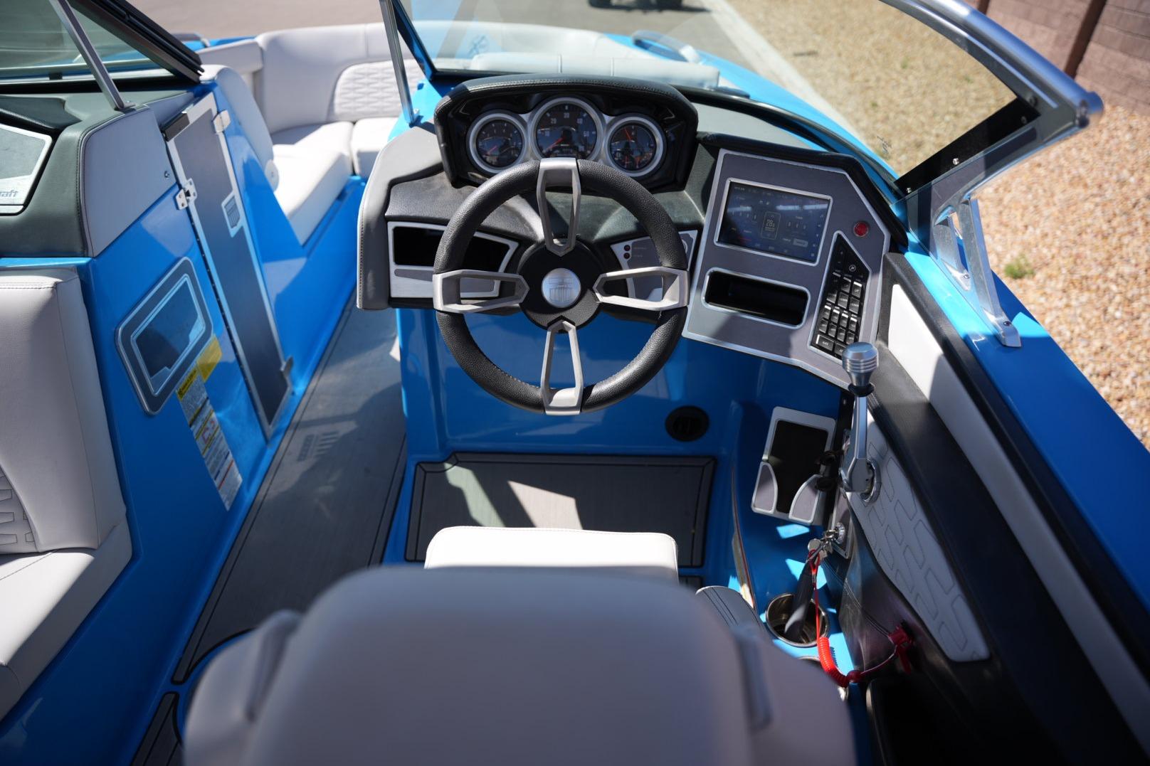 2020 MasterCraft X22 boat interior with modern dashboard and steering wheel.