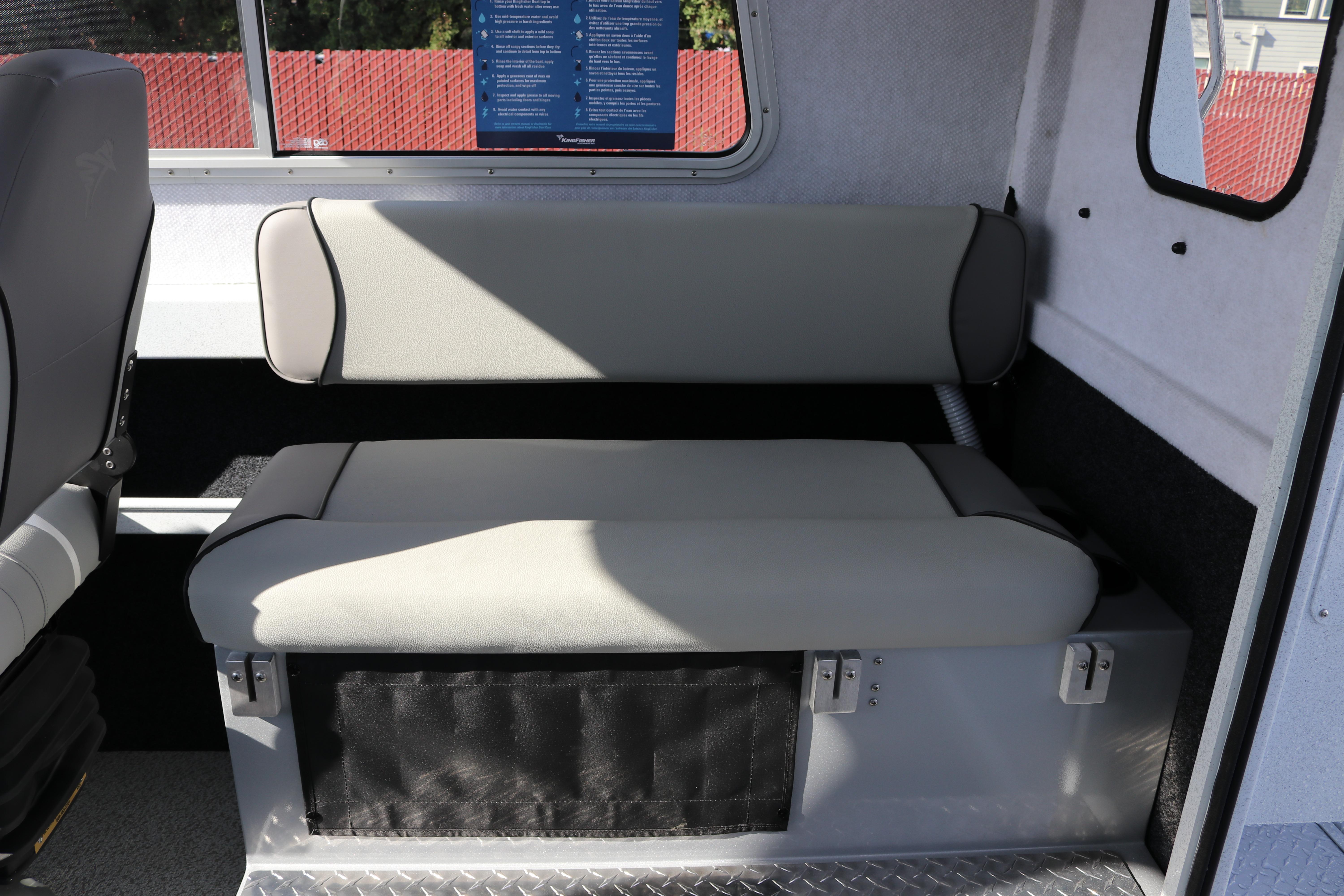 Interior seating of 2026 KingFisher 2425 Escape HT boat, featuring gray upholstery.