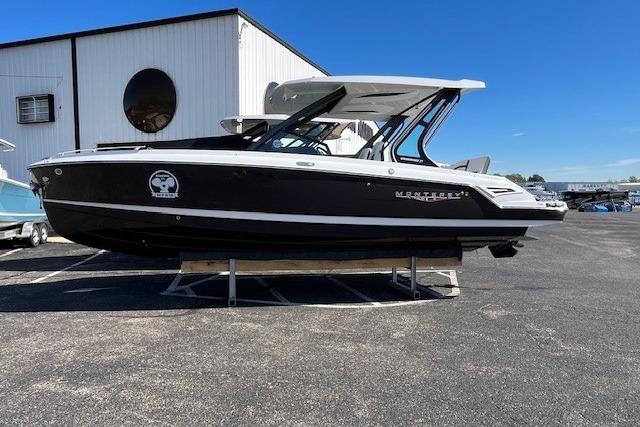 2026 Monterey Elite 27 SD boat displayed outdoors on a sunny day.