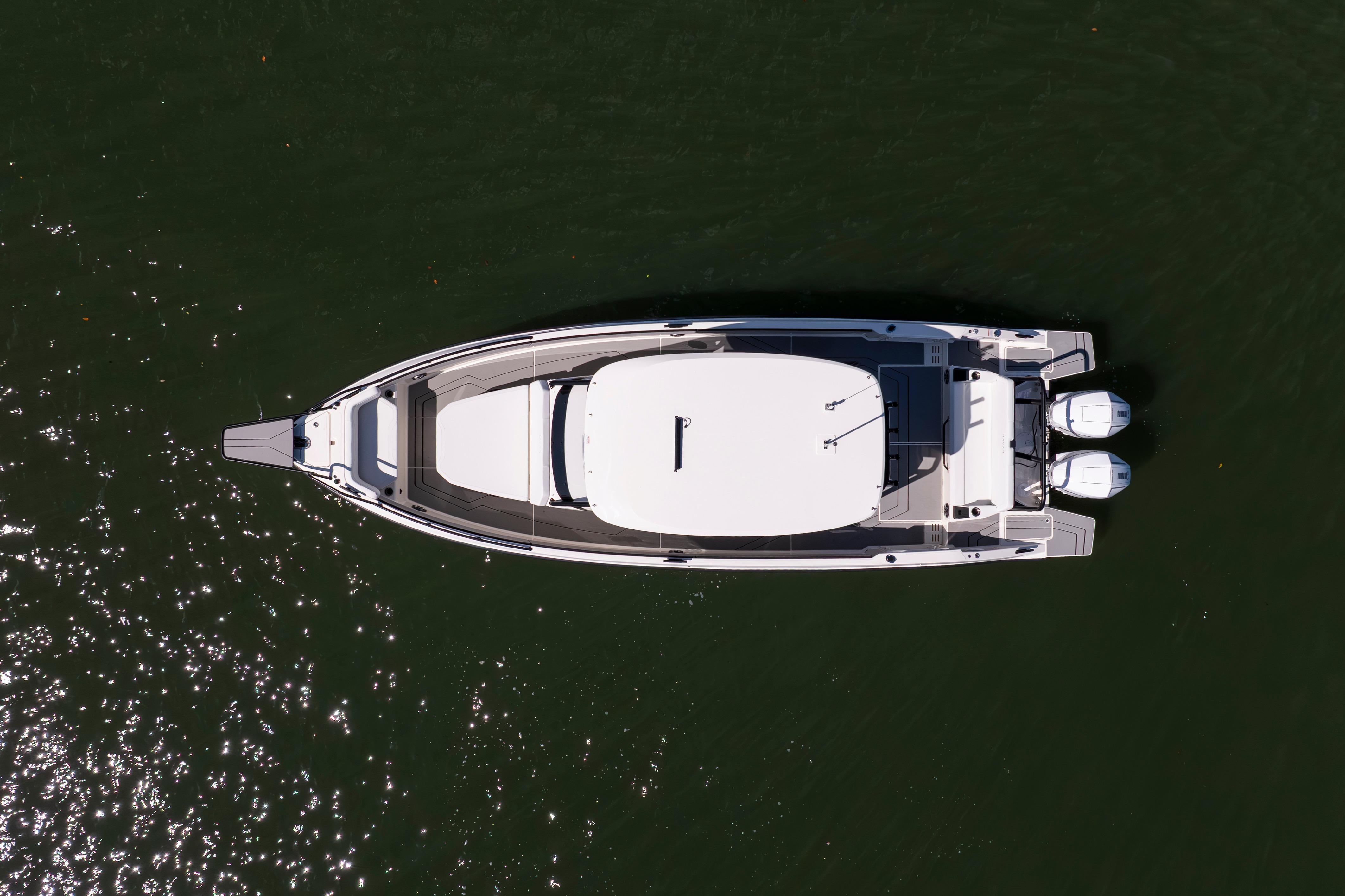 Aerial view of 2027 Navan T30 boat on water with twin engines.