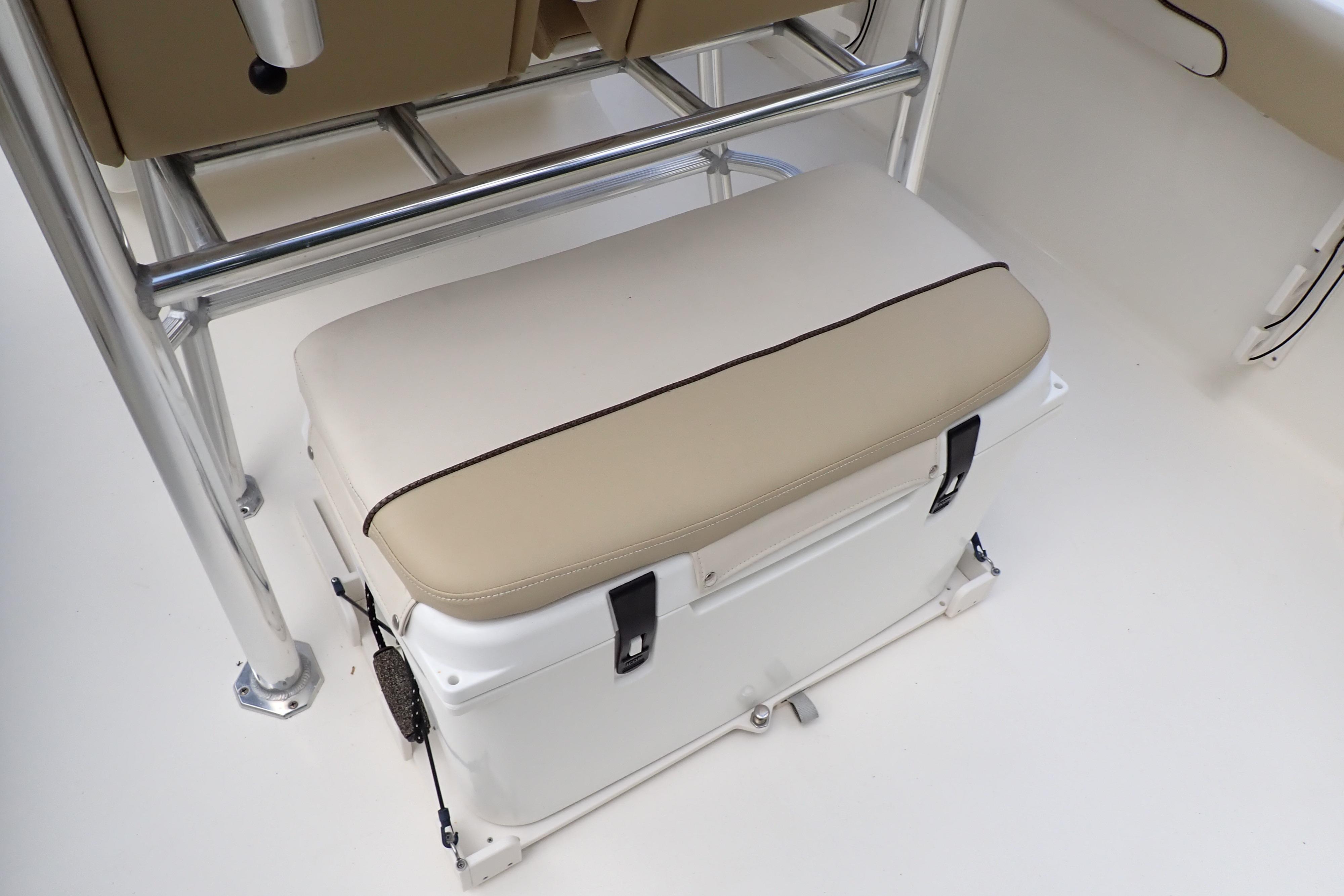 2019 Key West 263 FS boat seat with integrated cooler and beige cushion.