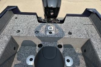 2026 Tracker Pro Guide V-175 WT boat interior with motor, featuring spacious seating and storage.