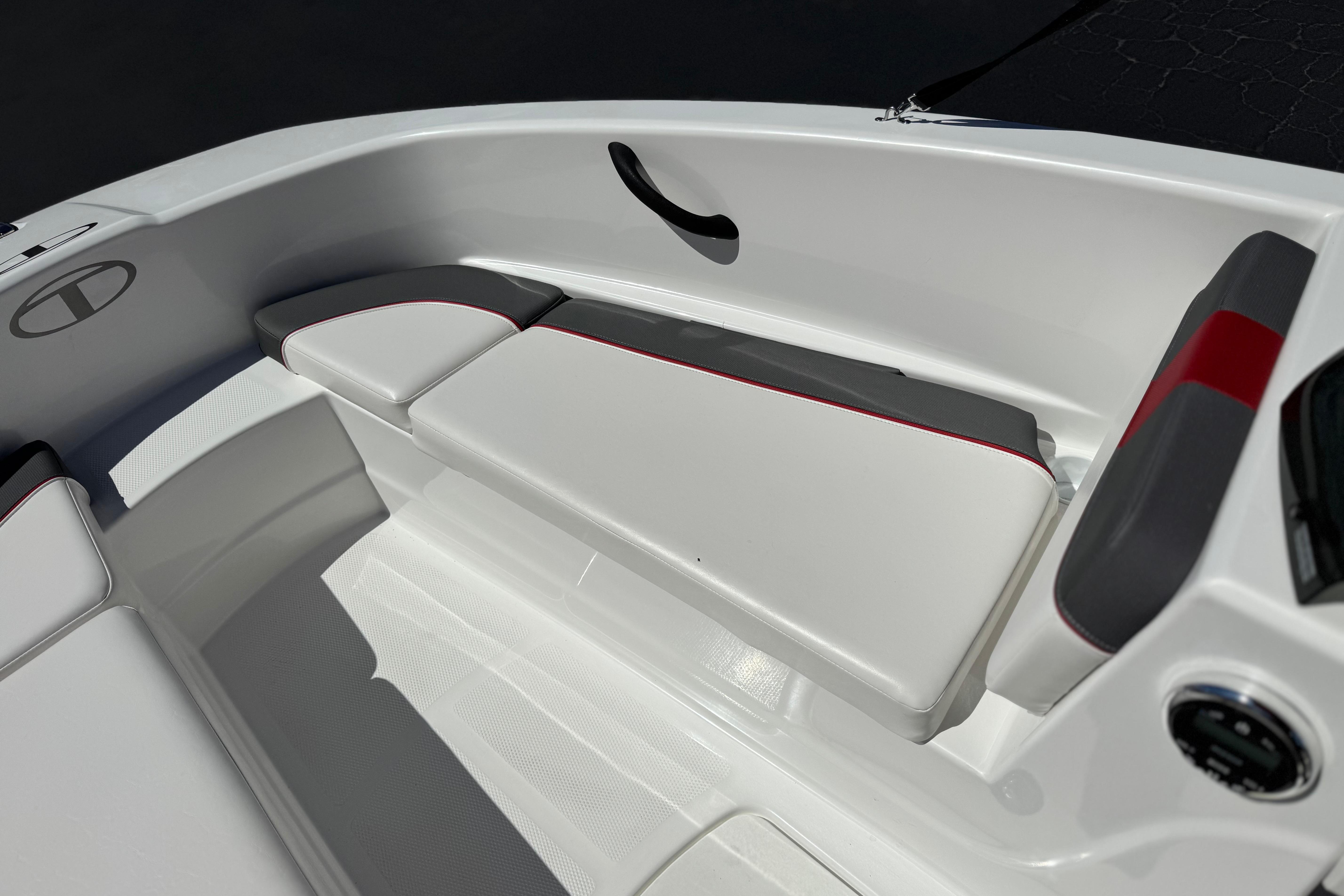 2024 Tahoe T16 boat interior with white and gray seating, red accents.