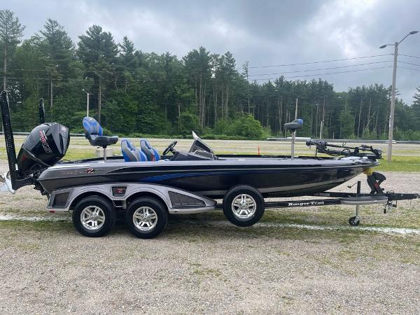 2025 Ranger Z520R bass boat on trailer, parked outdoors with forest background.