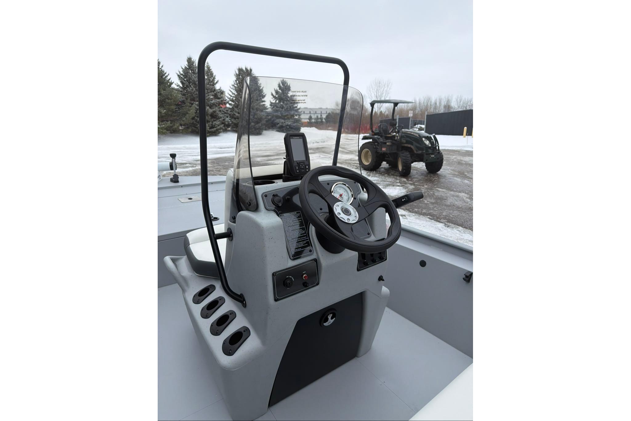 2026 Tracker Bass Tracker Classic CC boat console with steering wheel and controls.