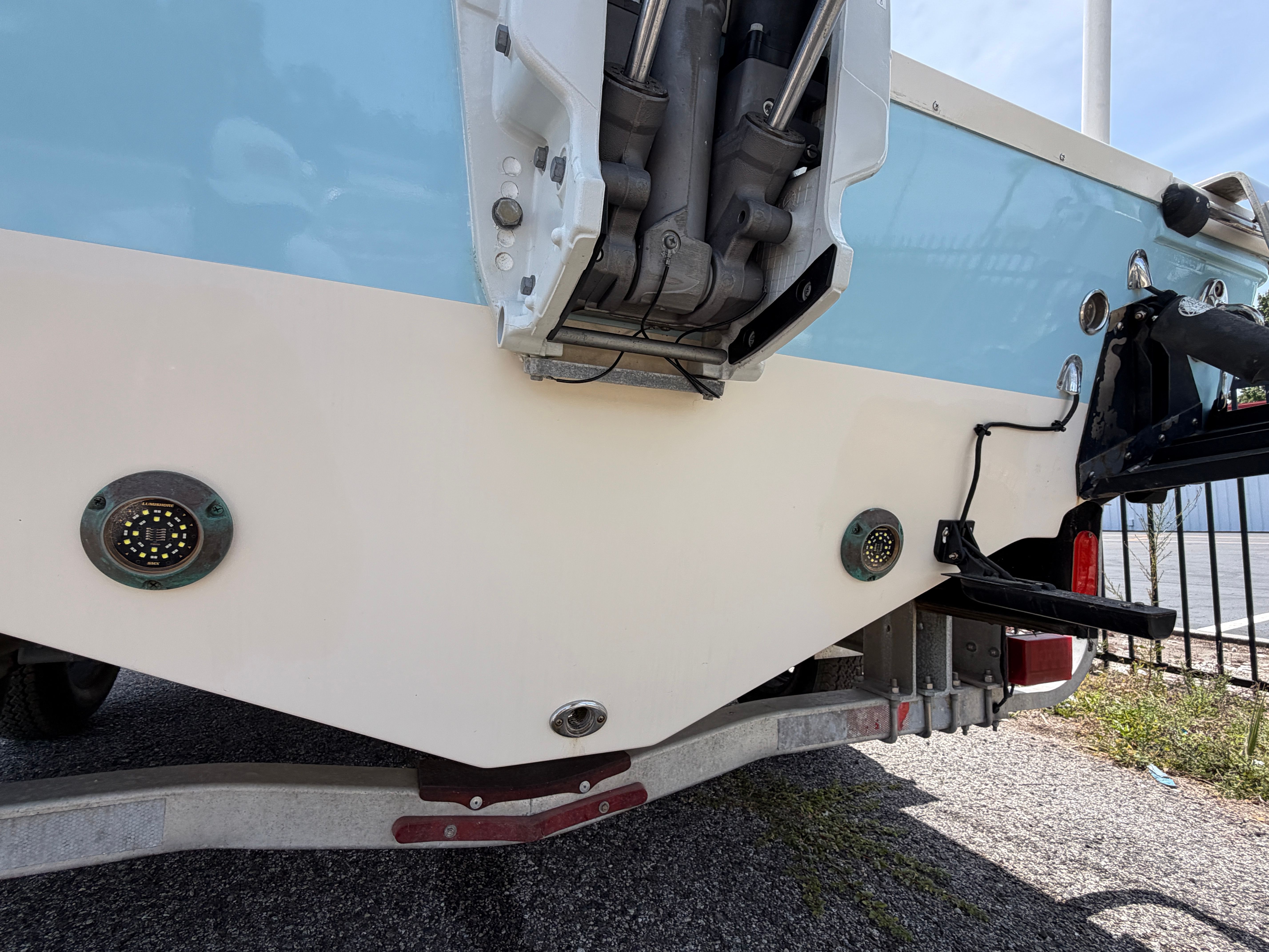 Rear view of a 2004 McKee Craft 24 FREEDOM boat on a trailer.