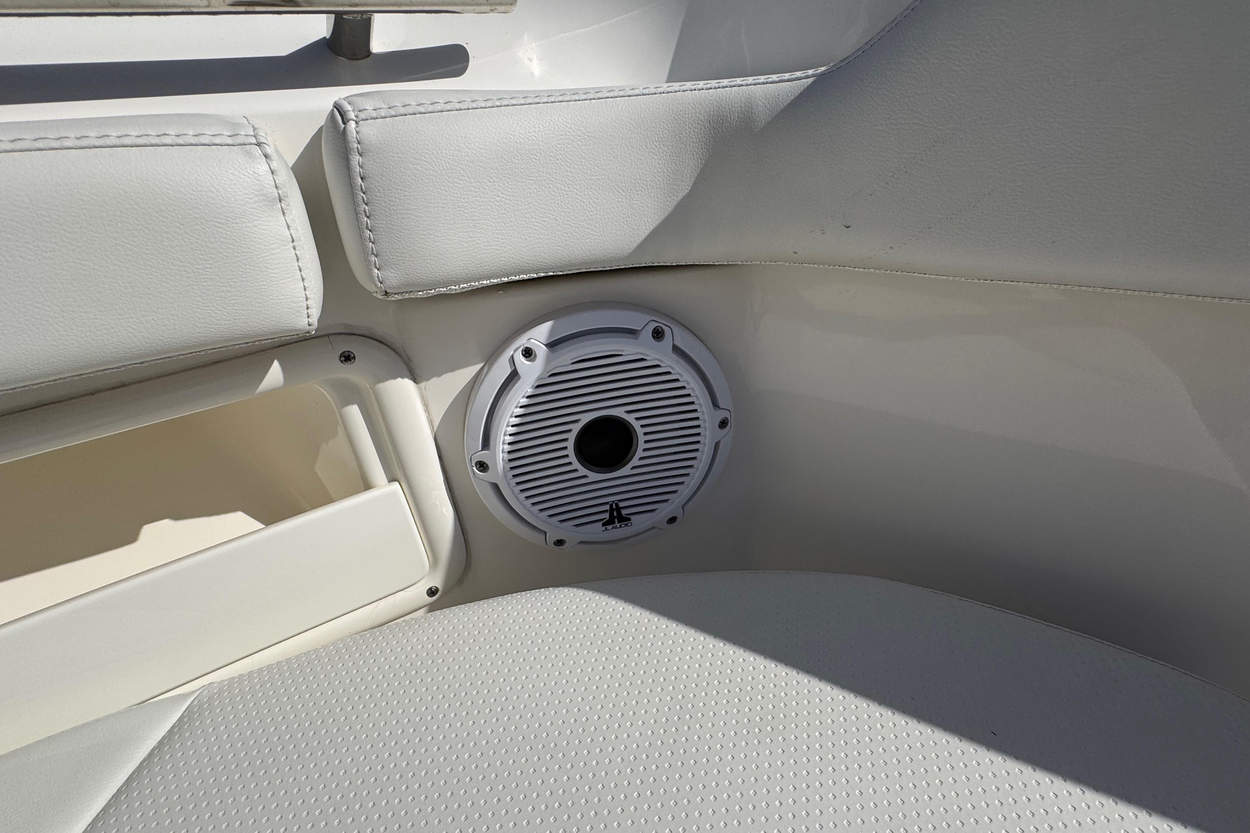 2022 Pursuit DC 266 Dual Console boat interior with speaker and cushioned seating.