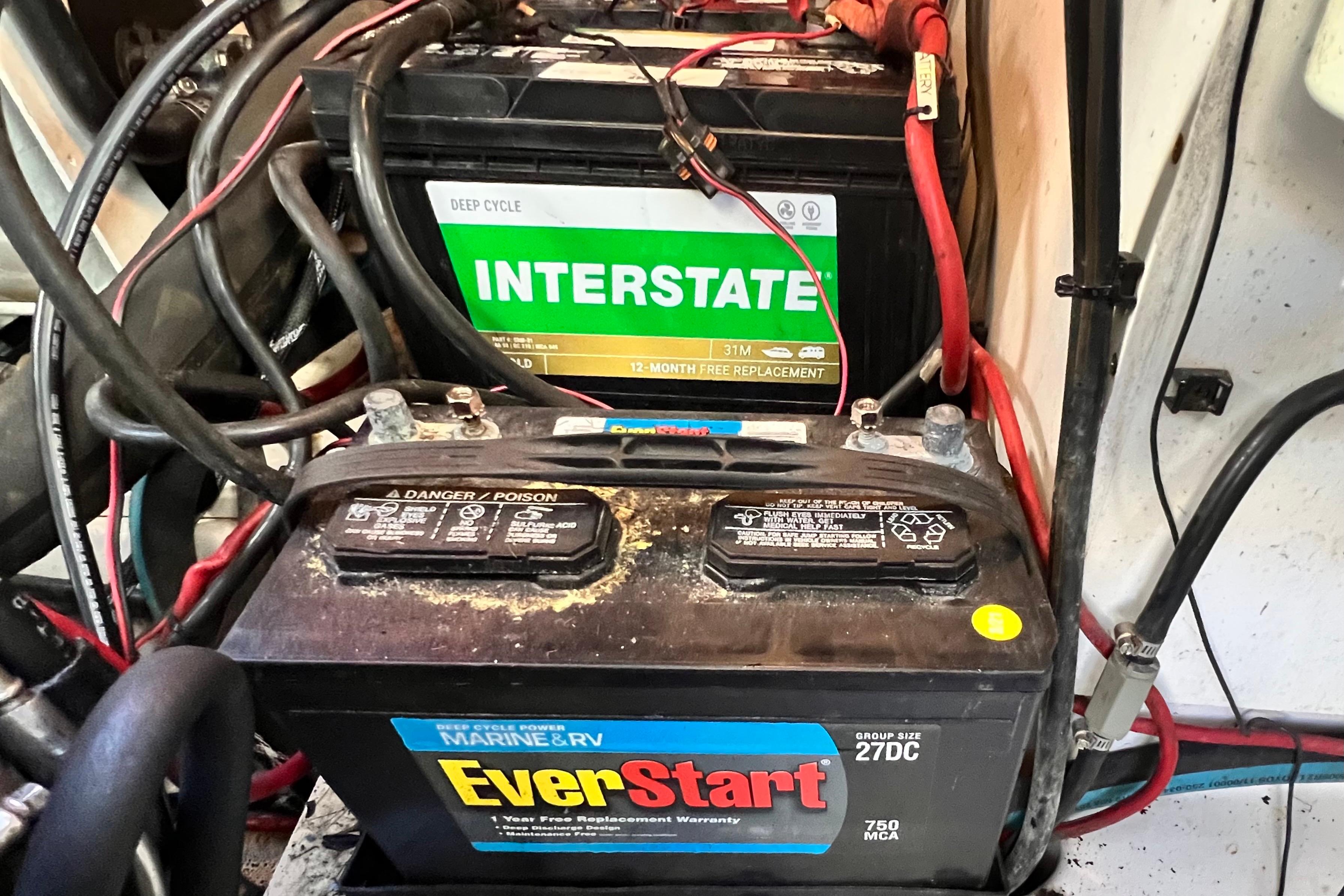Marine batteries in a 2006 Four Winns 348 Vista boat engine compartment.