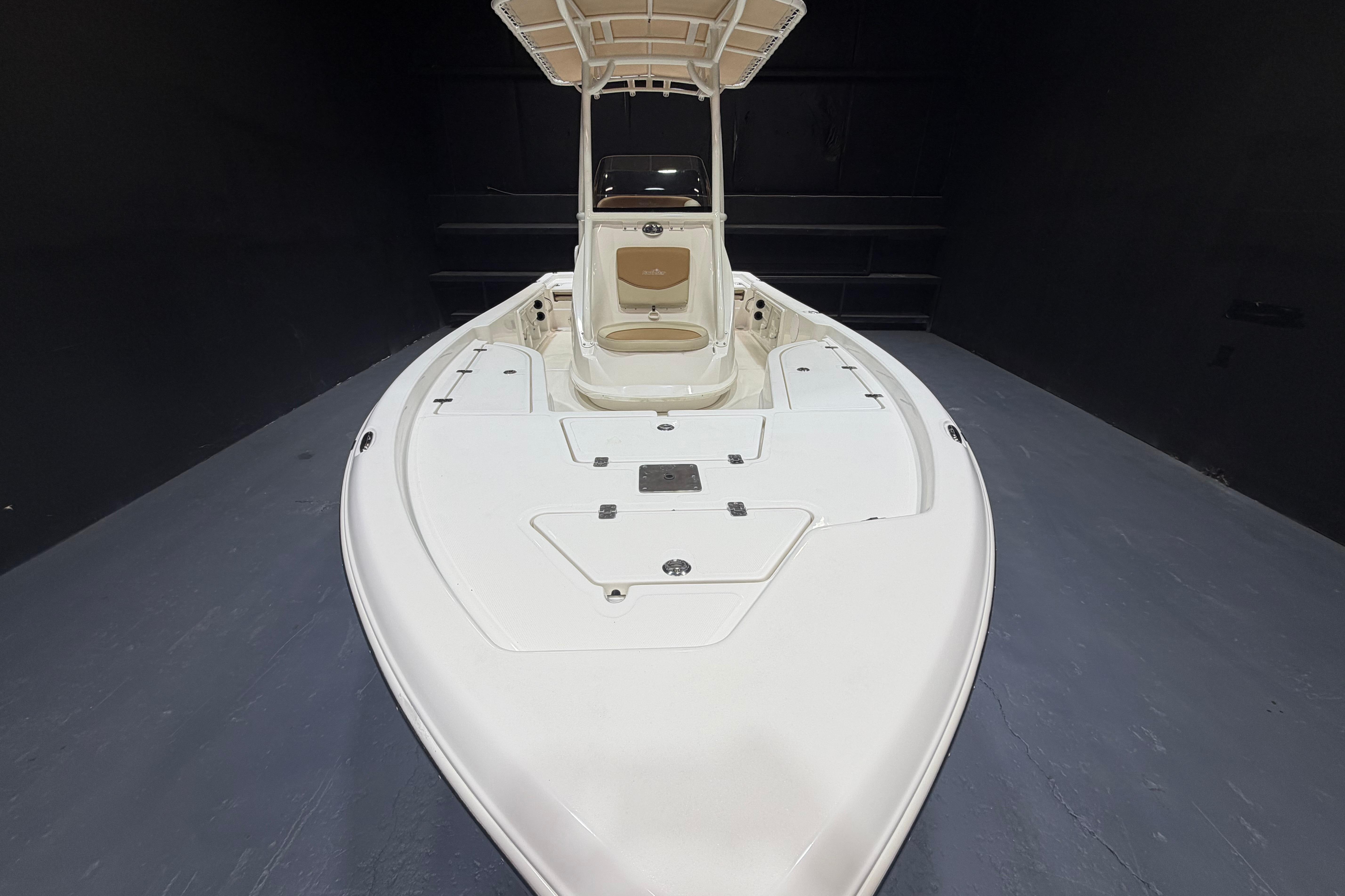 2023 NauticStar 215 XTS boat, front view, showcasing sleek design and spacious deck.