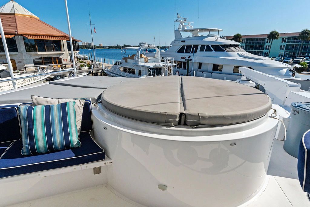 Luxury yacht Westport 112 from 1999 in harbor with hot tub.