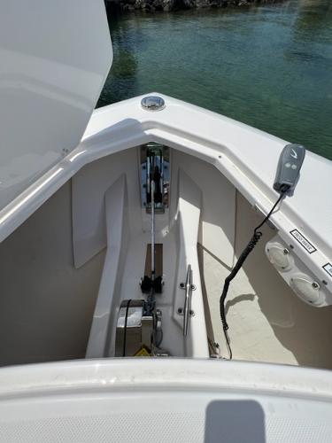2019 Pursuit S 408 Sport boat anchor compartment with winch and controls.