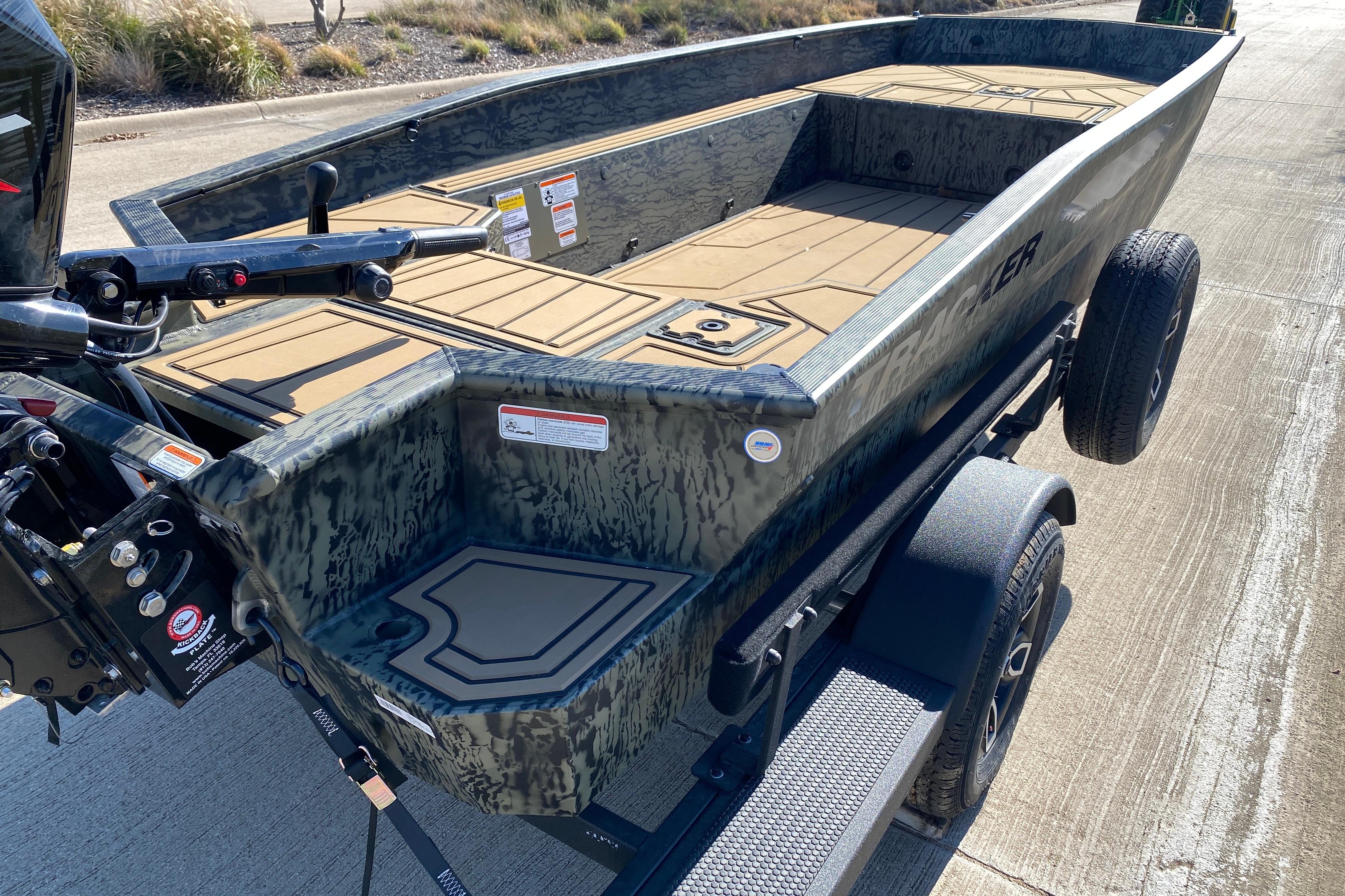 2026 Tracker Grizzly 1650 T Prairie Wings Edition boat on trailer, camo design.