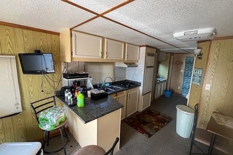 Interior of a 1995 Myacht 40X13 houseboat with kitchen and living area.