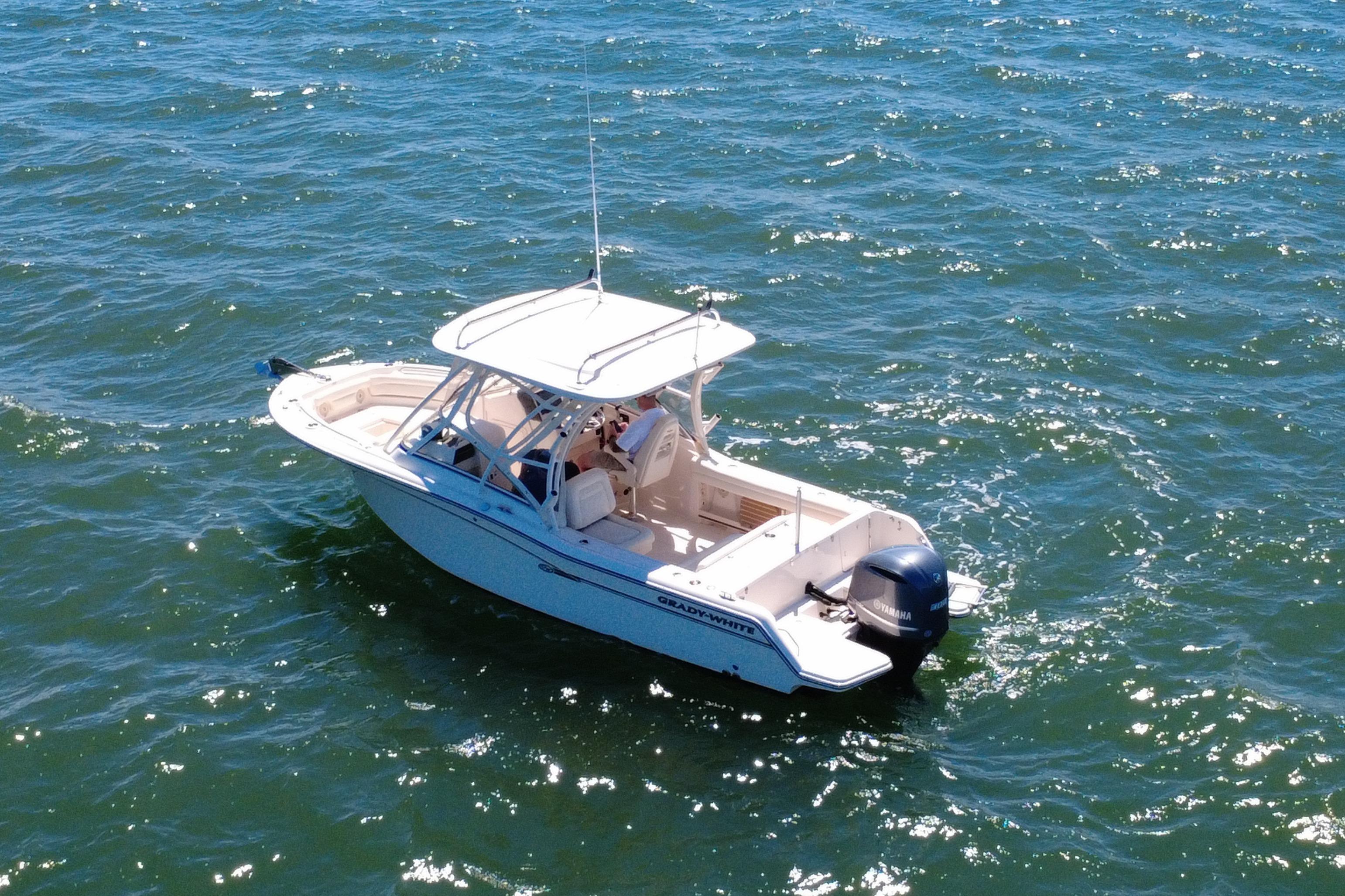 2017 Grady-White Freedom 235 boat cruising on open water.