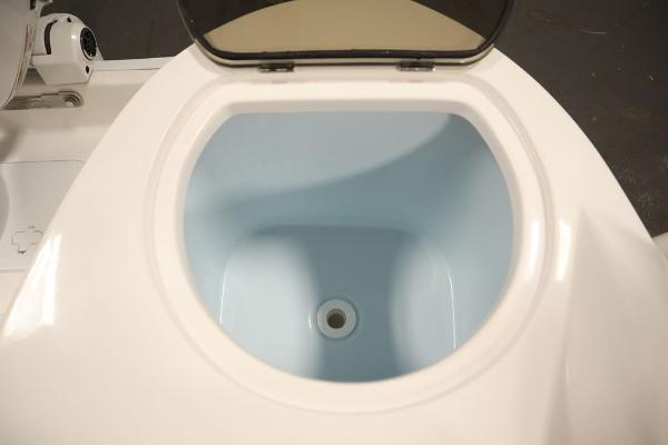 2025 Sea Fox 228 Traveler boat livewell, open lid, white and blue interior.