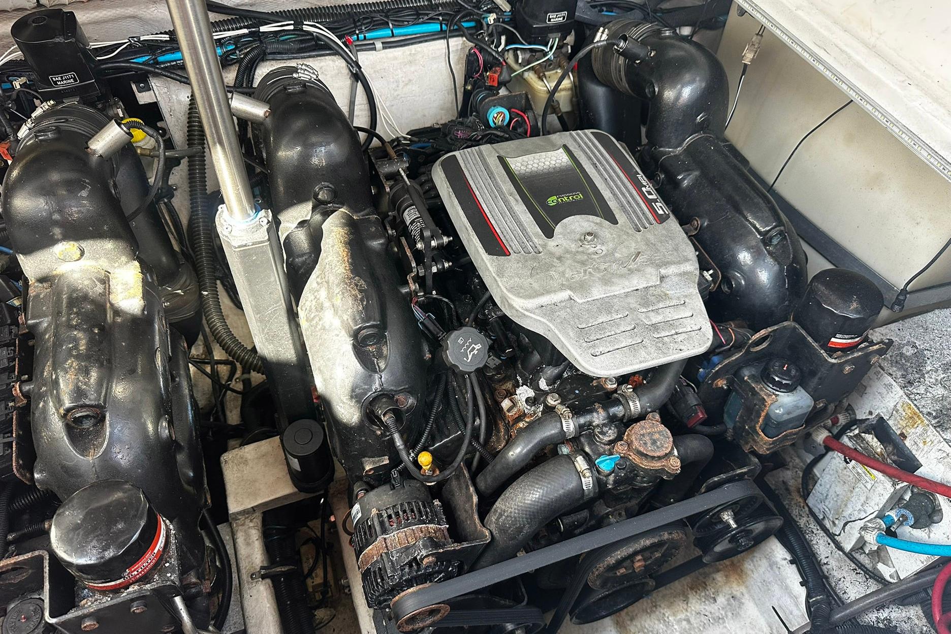 Engine compartment of a 2012 Rinker 310 Express Cruiser LE boat.
