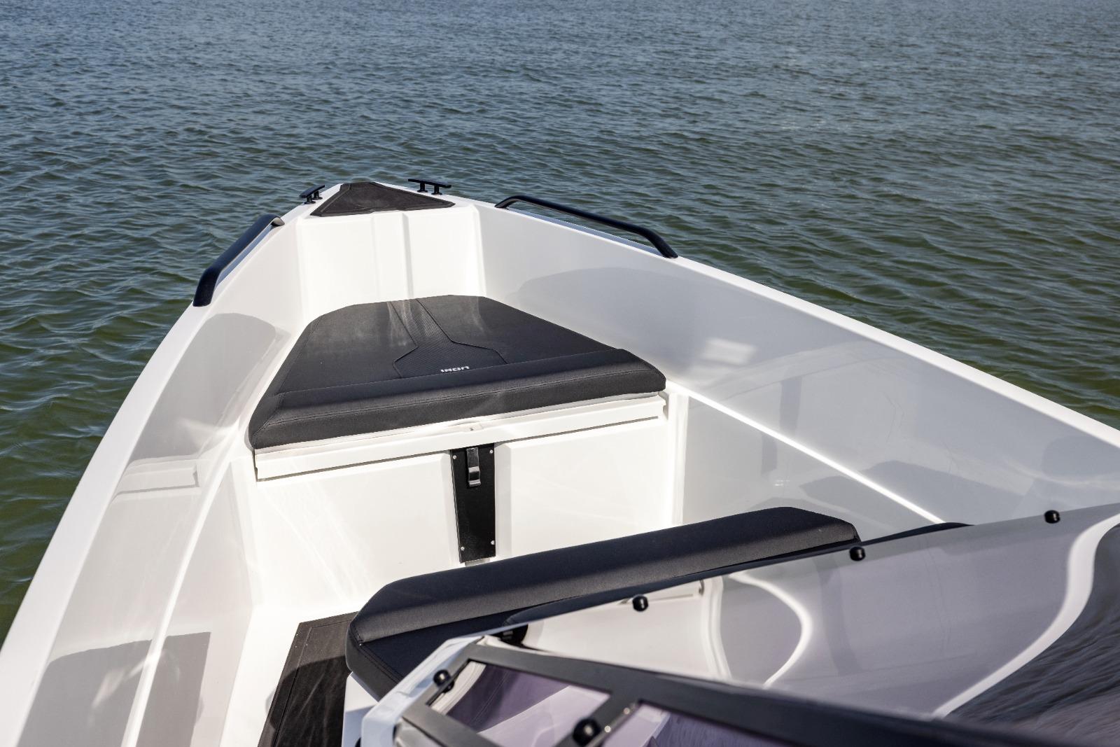 Iron 707 boat interior, 2022 model, featuring sleek seating and open water view.