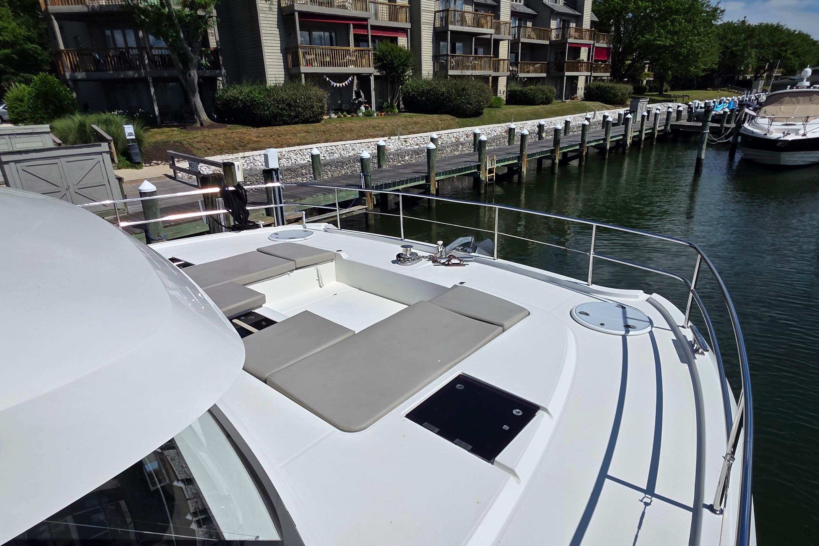 2018 Fountaine Pajot Motor Yacht 44 docked, featuring spacious deck and seating area.