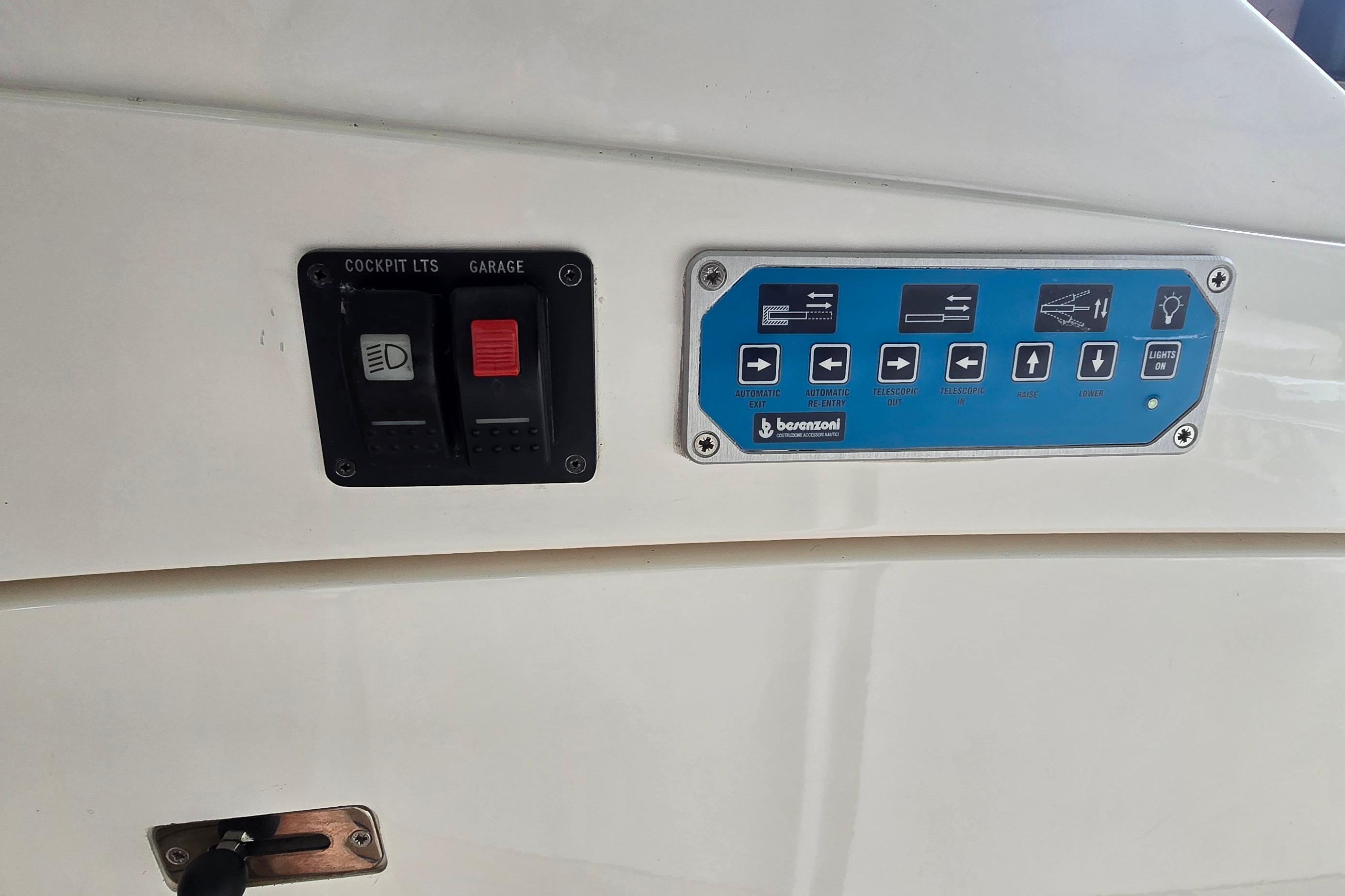 Control panel of a 2004 Sunseeker Camargue 50 yacht with labeled switches and buttons.